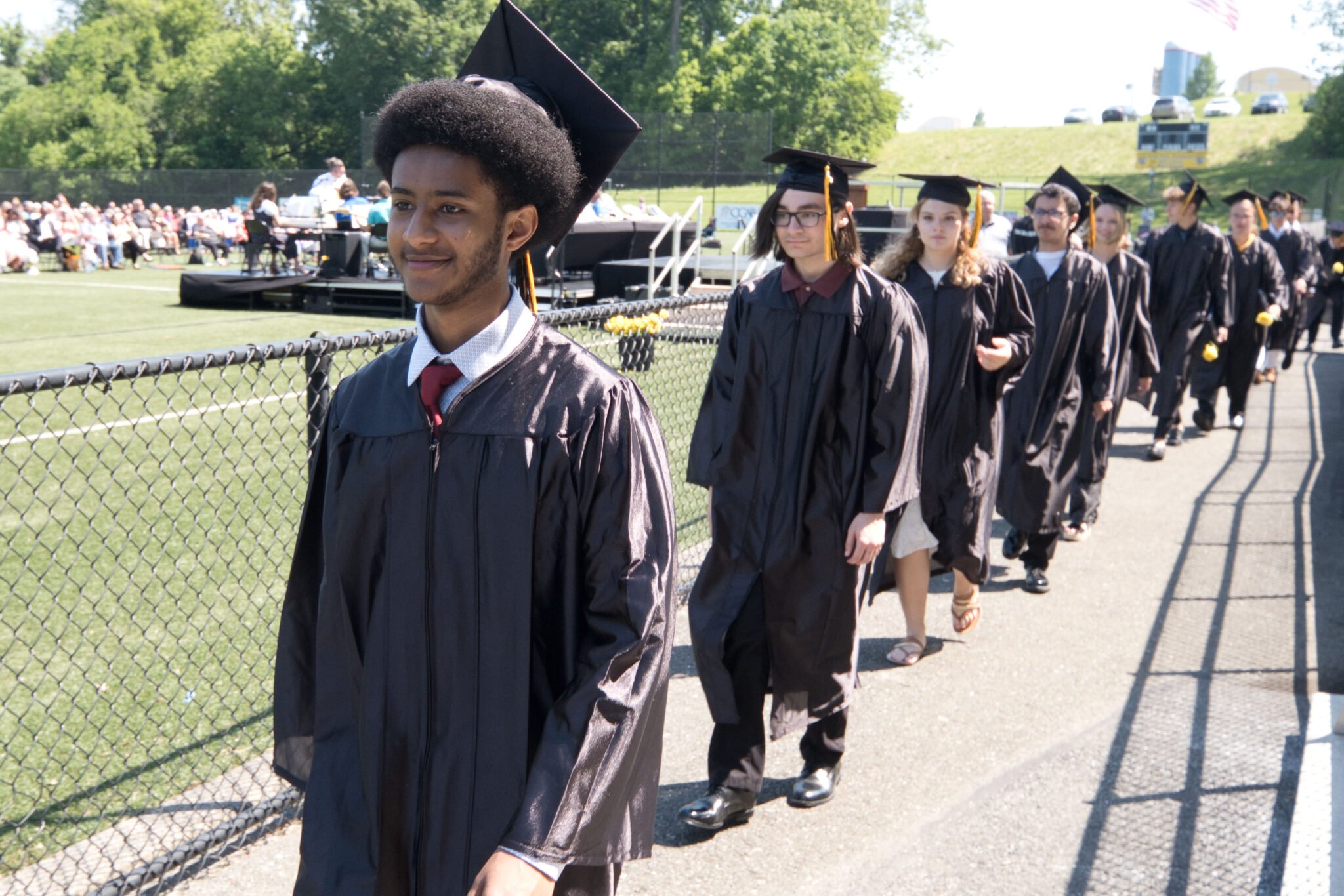 graduates walking into commencement