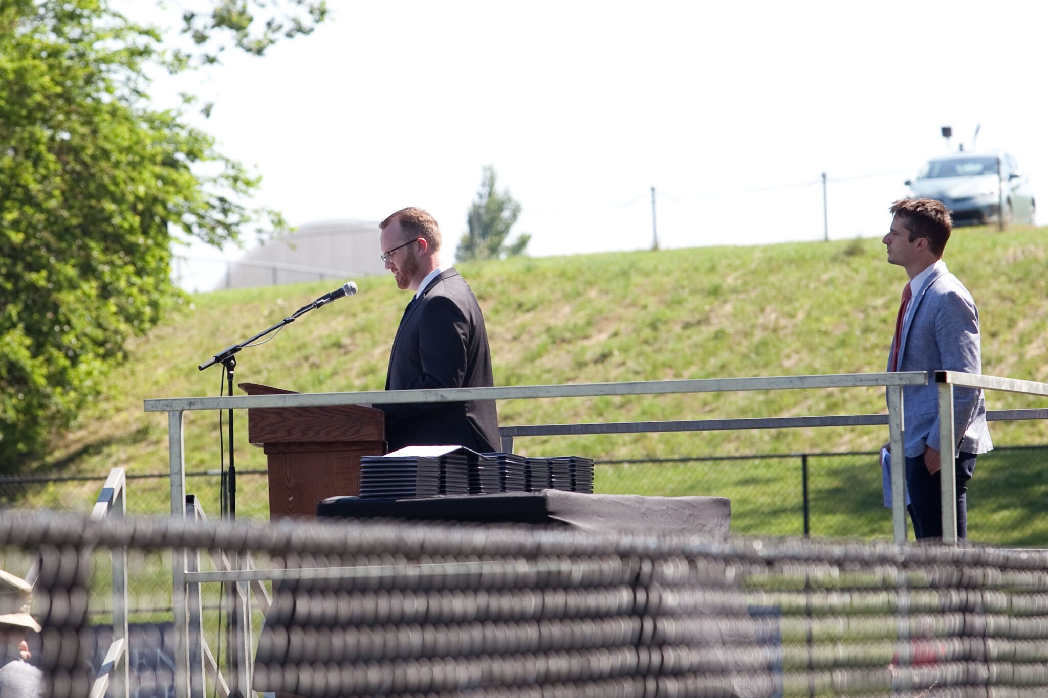 assistant superintendent speaks at podium
