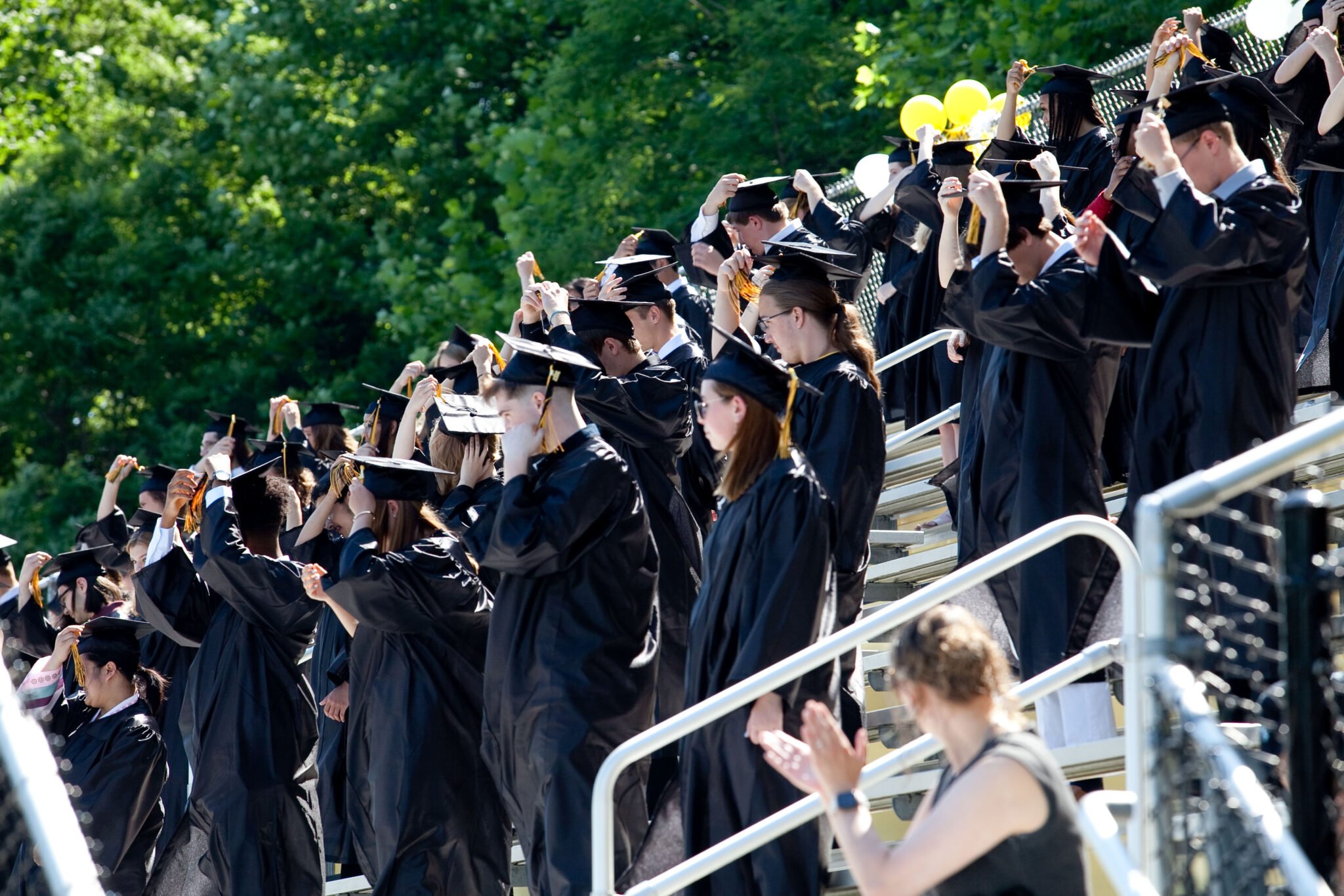 graduates at commencement service