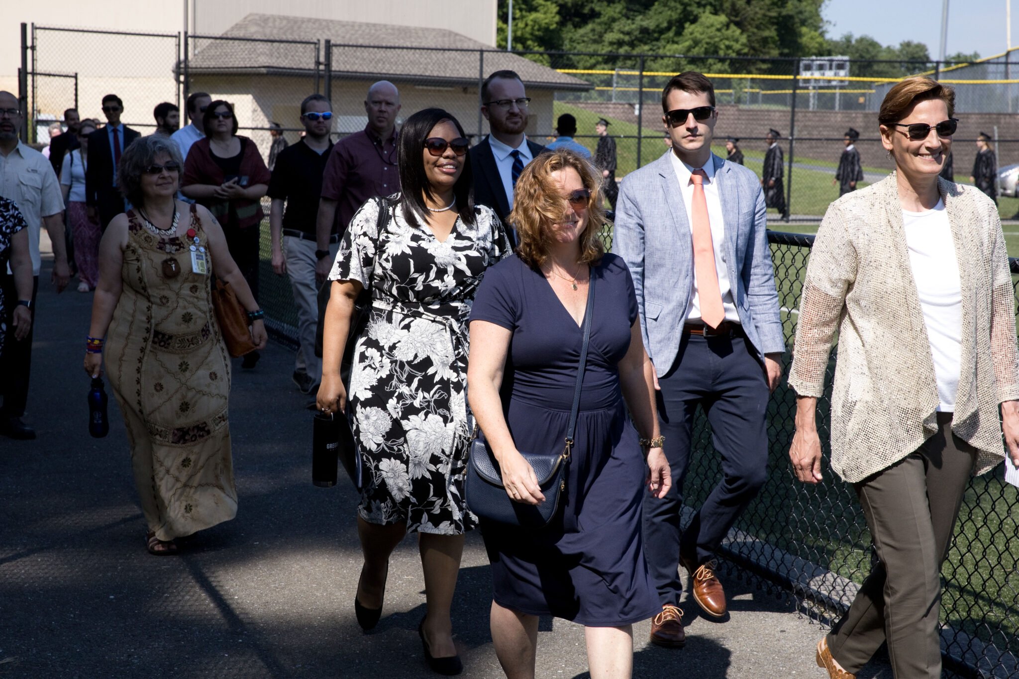 staff walking into commencement