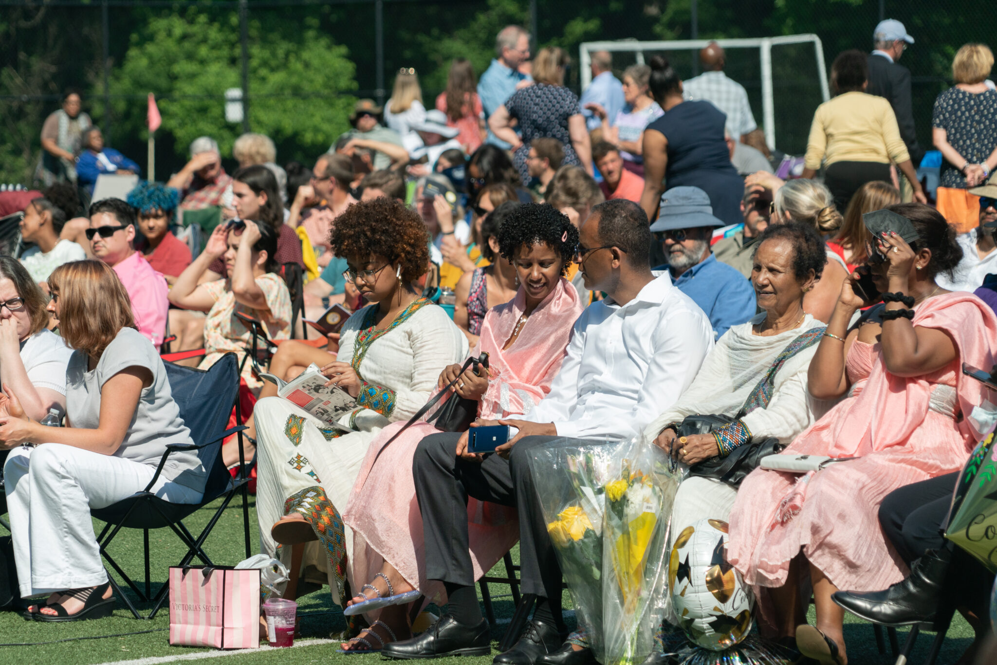 family waiting for commencement to start