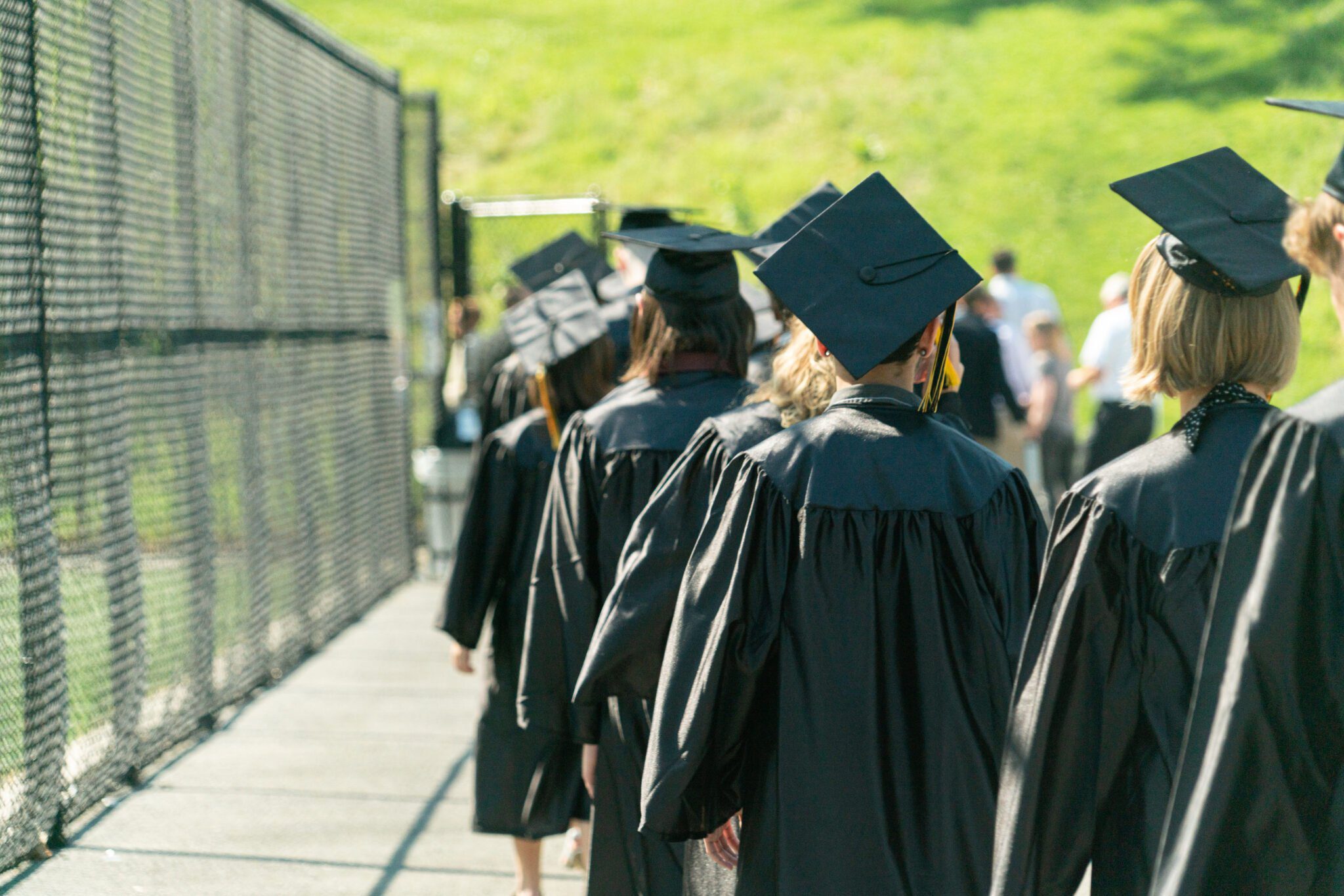 graduates walking into commencement