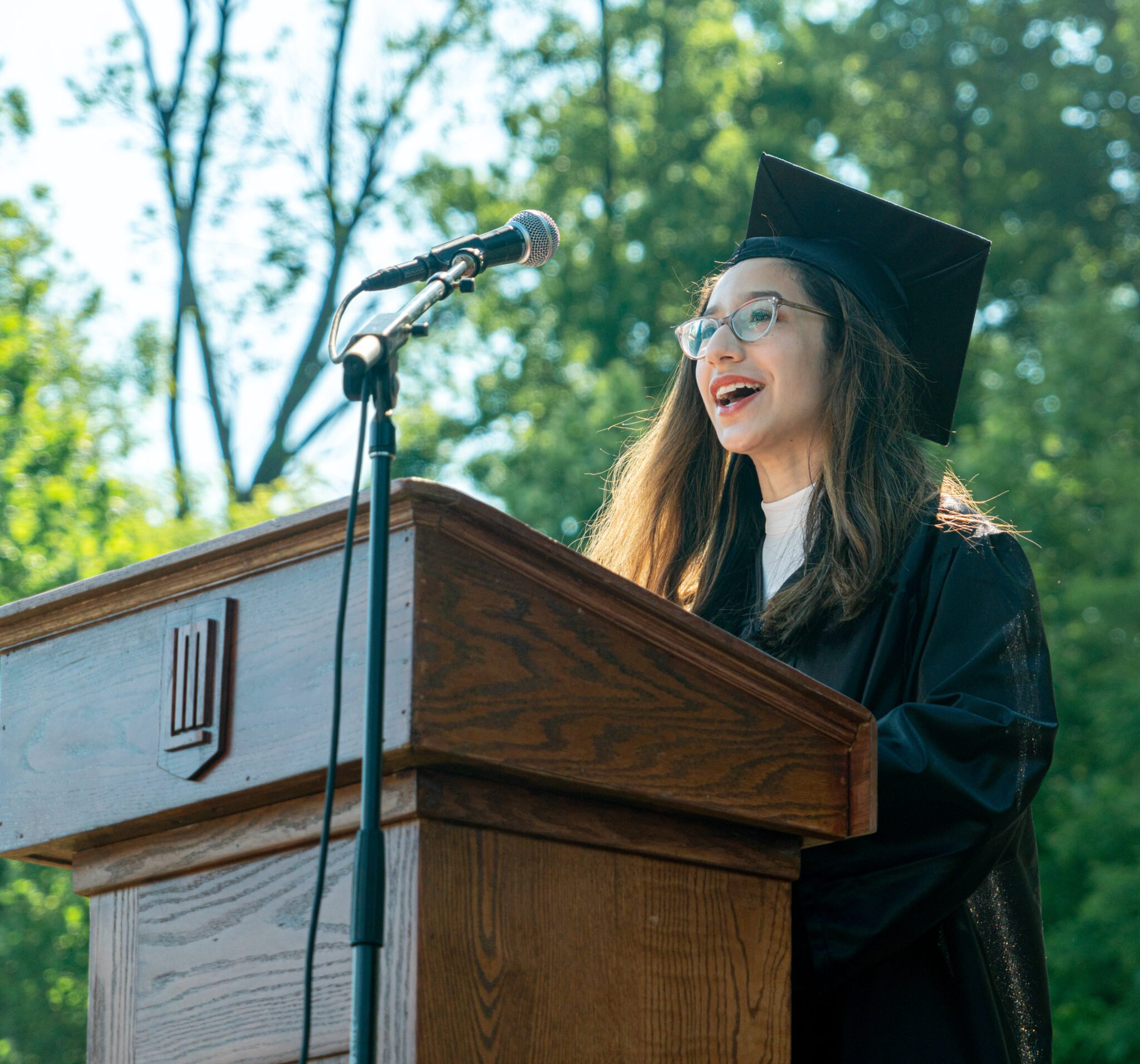 student talking at podium