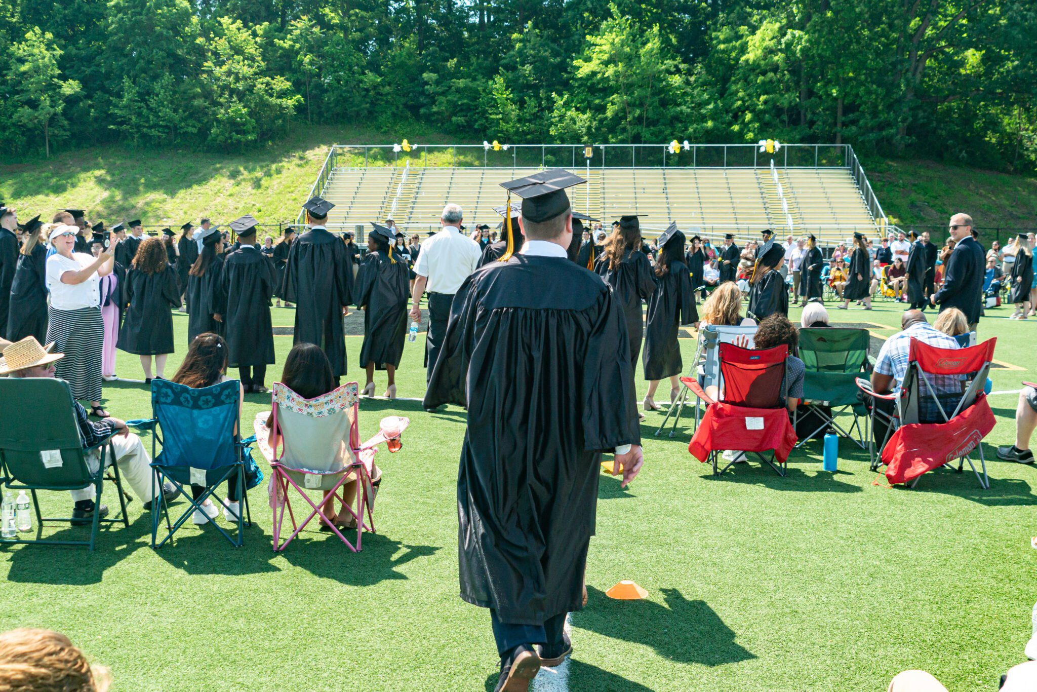 graduates and families celebrate after commencement service