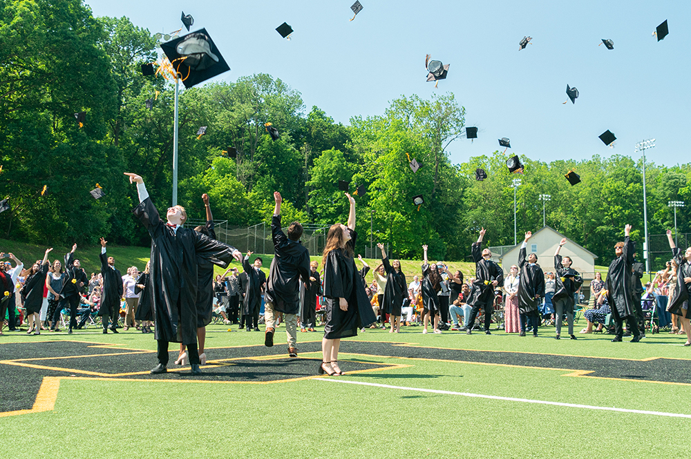 Graduation 2021 caps thrown up in the air