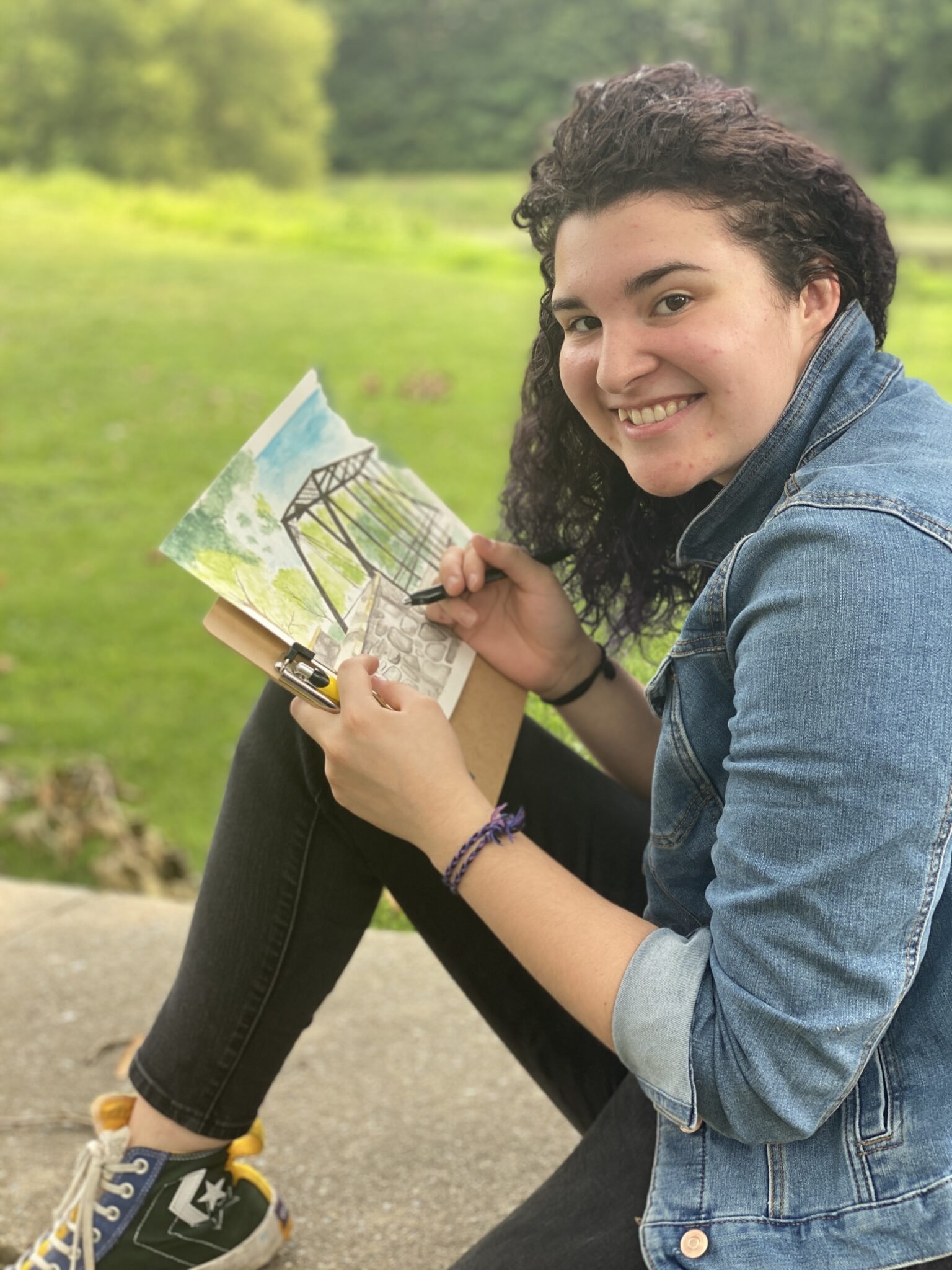 student watercolor and her near bridge