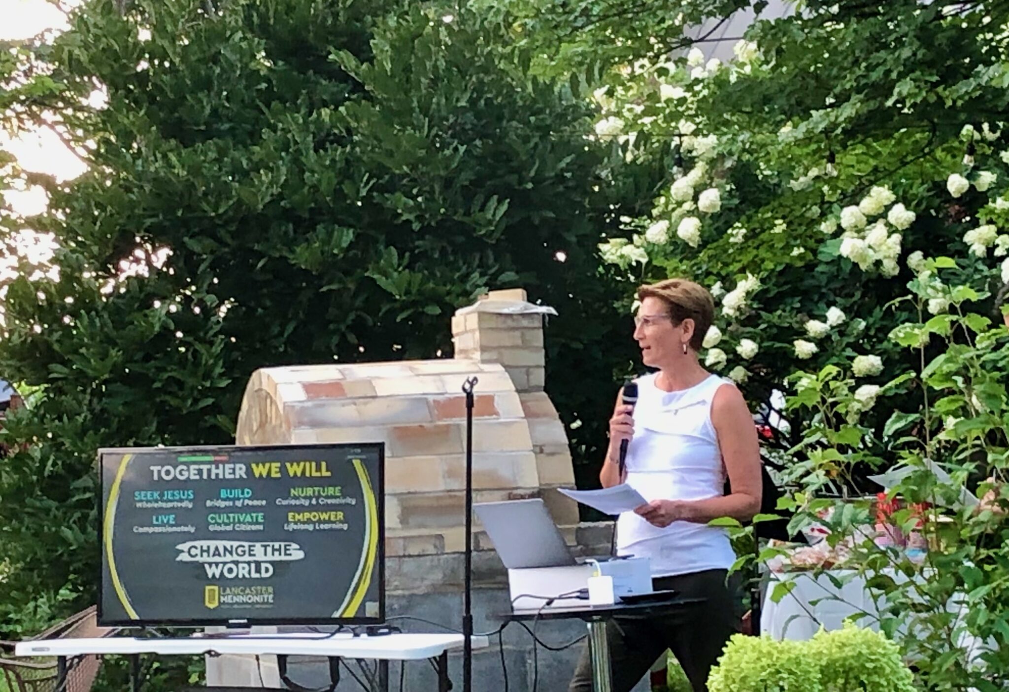 woman speaking at class reunion