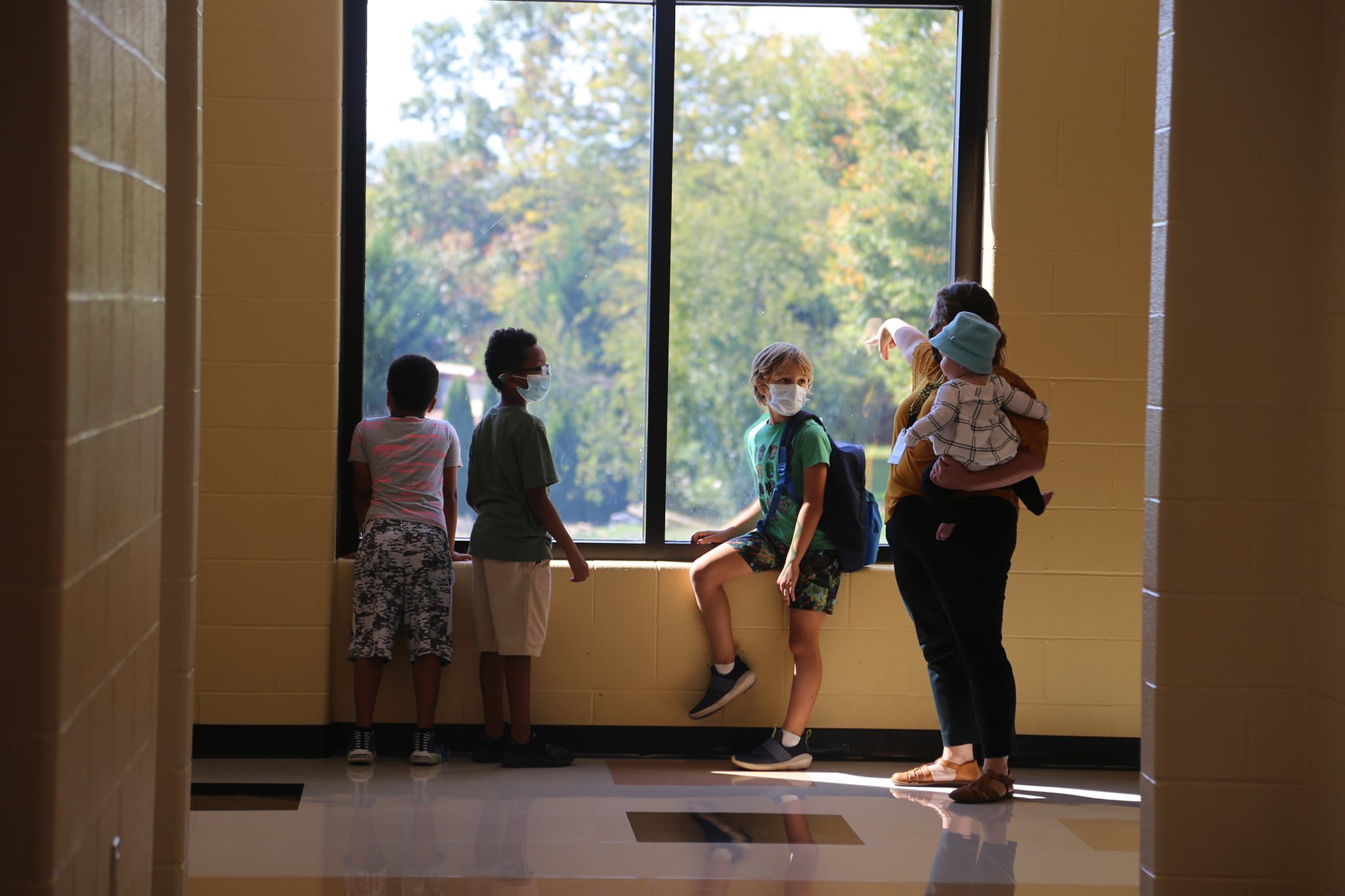 Students sitting at window