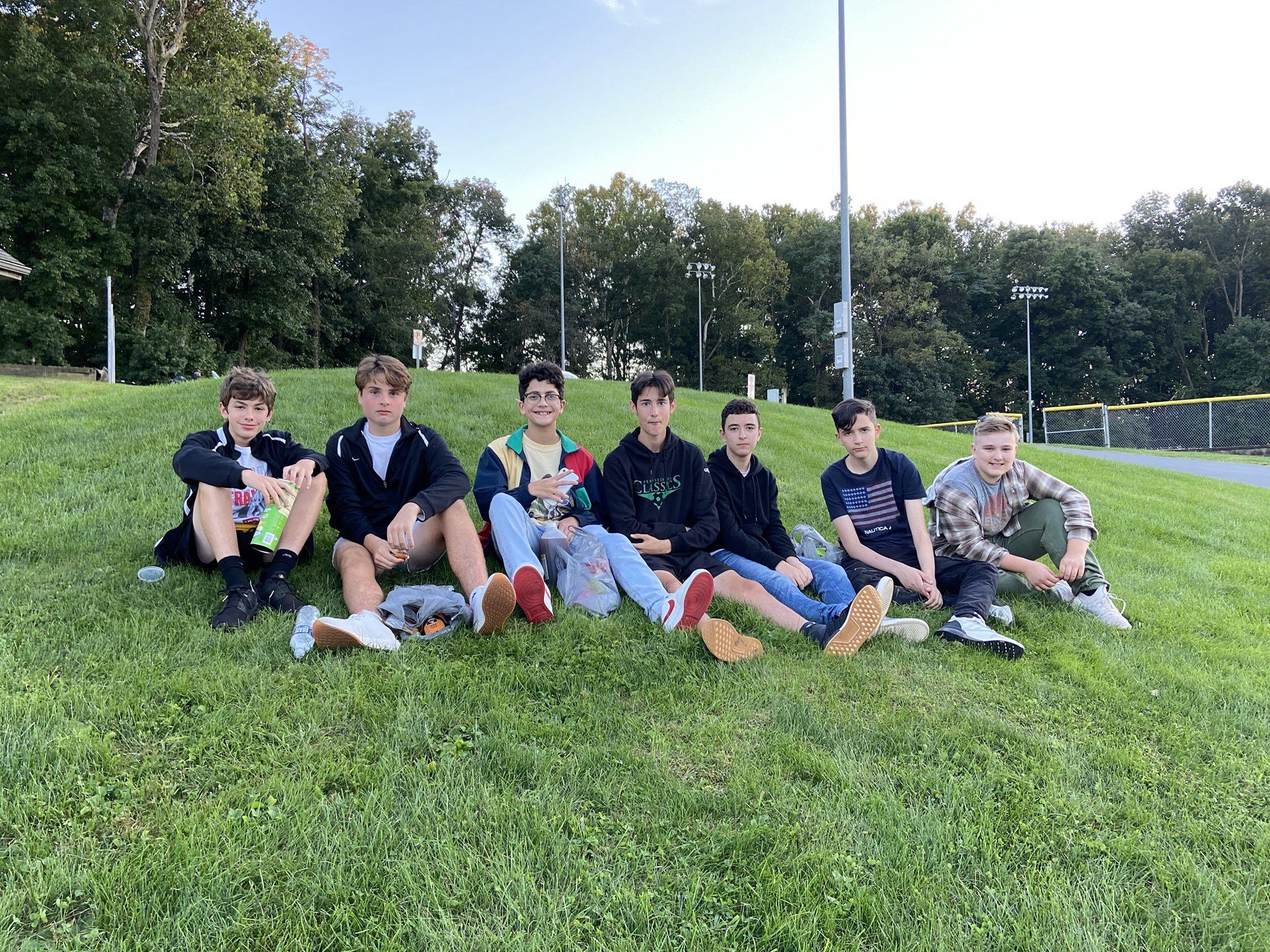 Students sitting in the grass