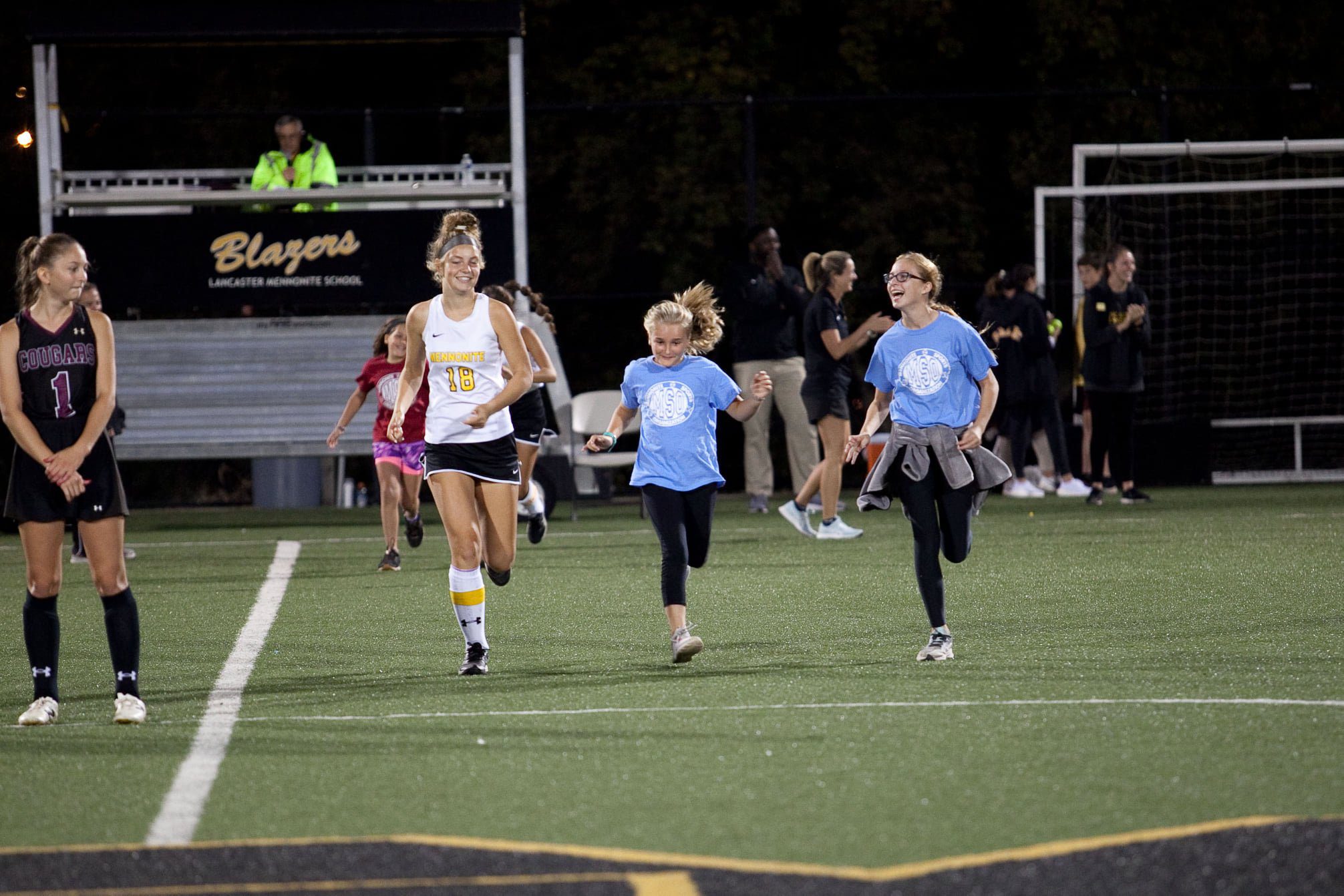 athletes on the turf