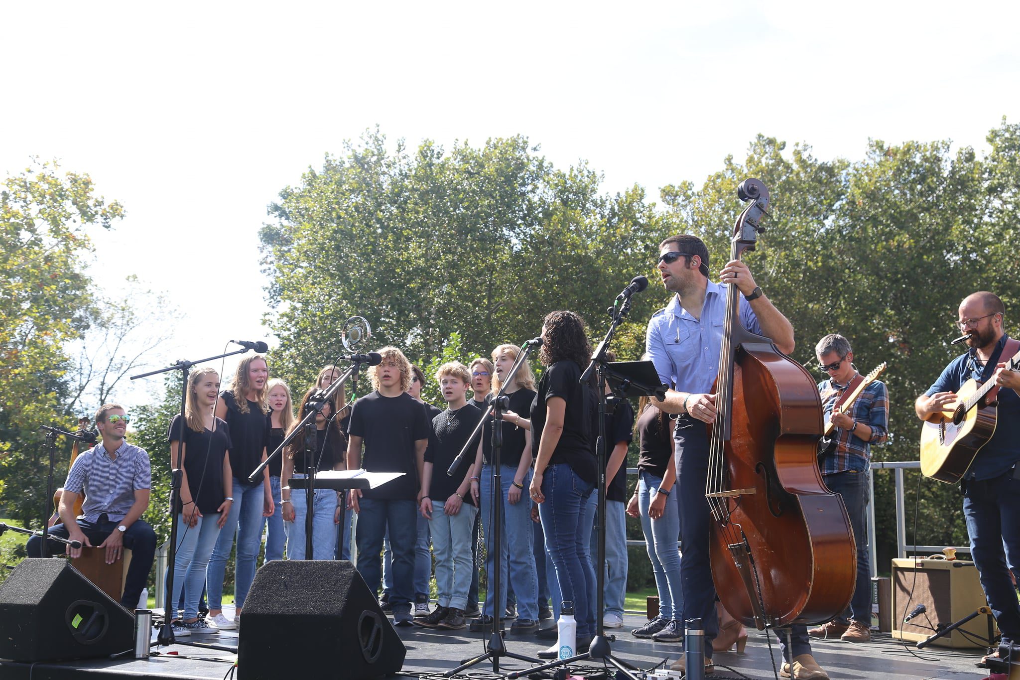 students on stage singing