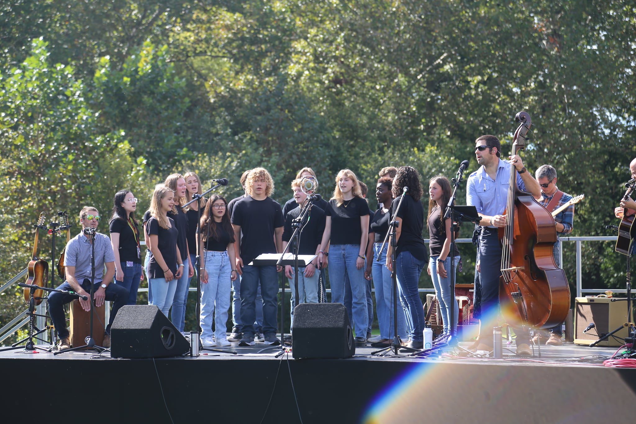 students on stage singing
