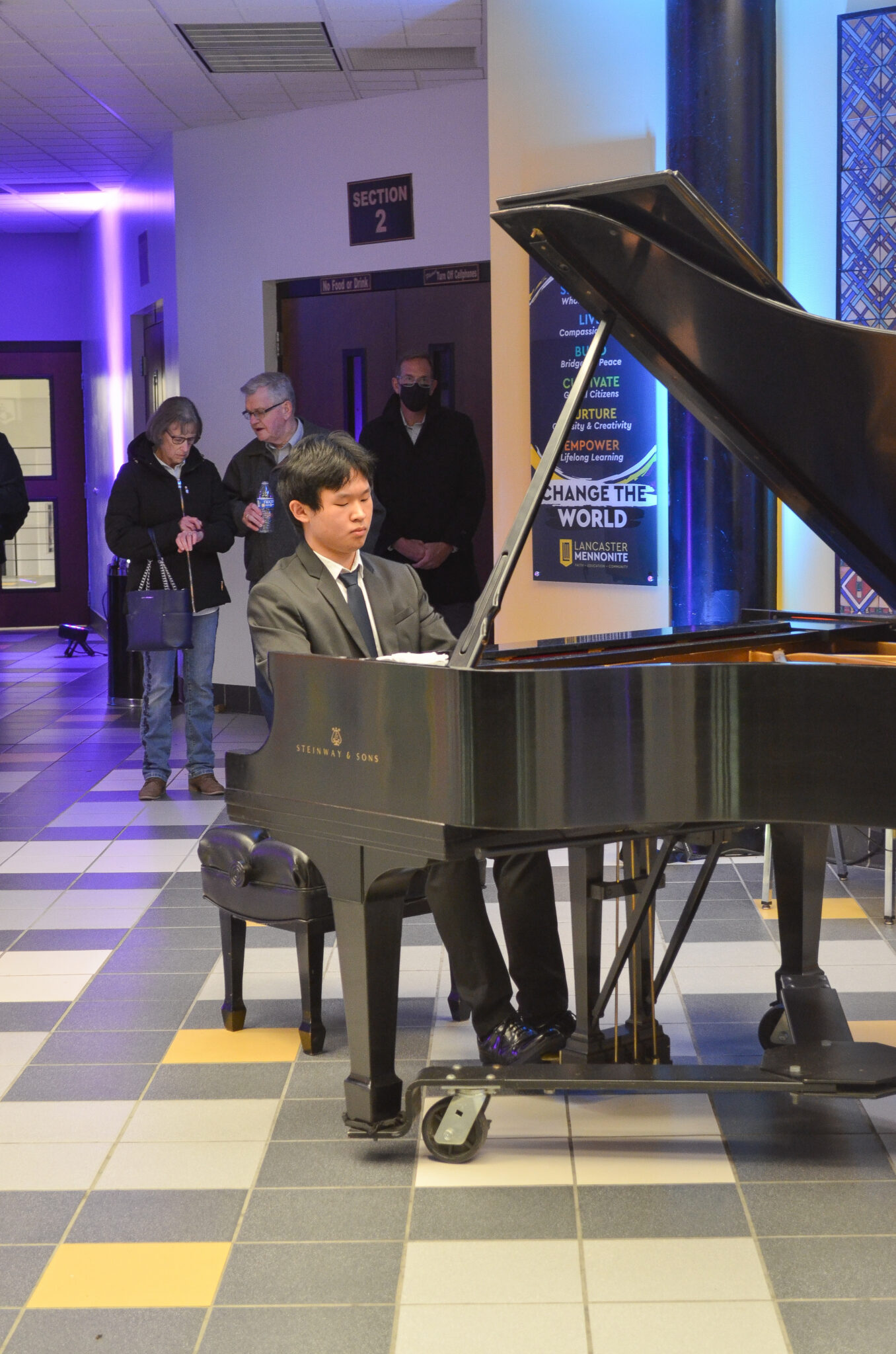 young man playing piano