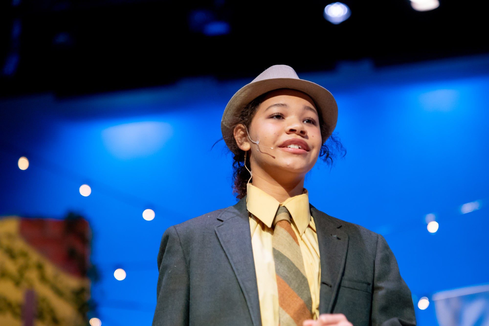 young woman wearing fedora