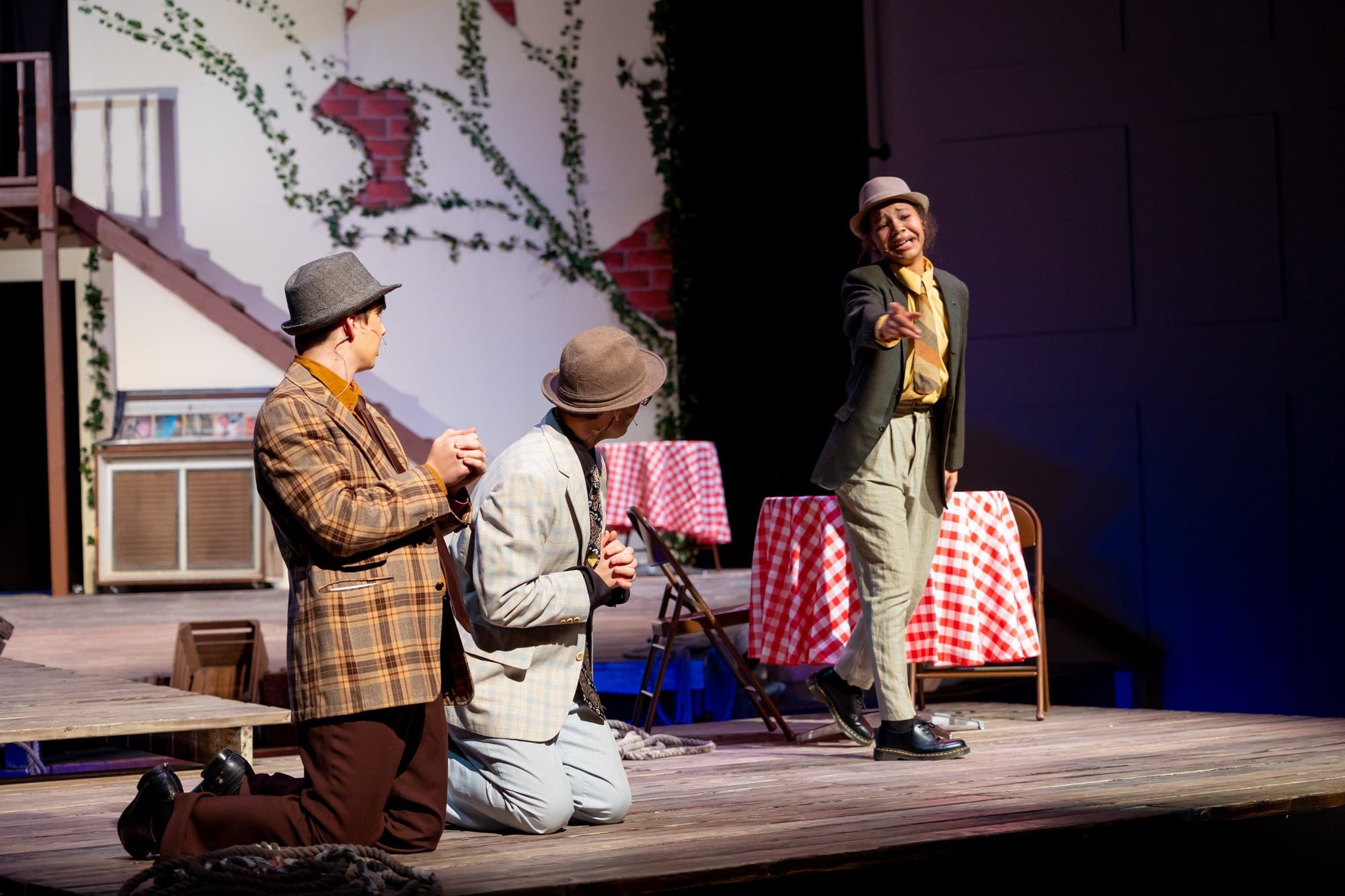 three student actors in play