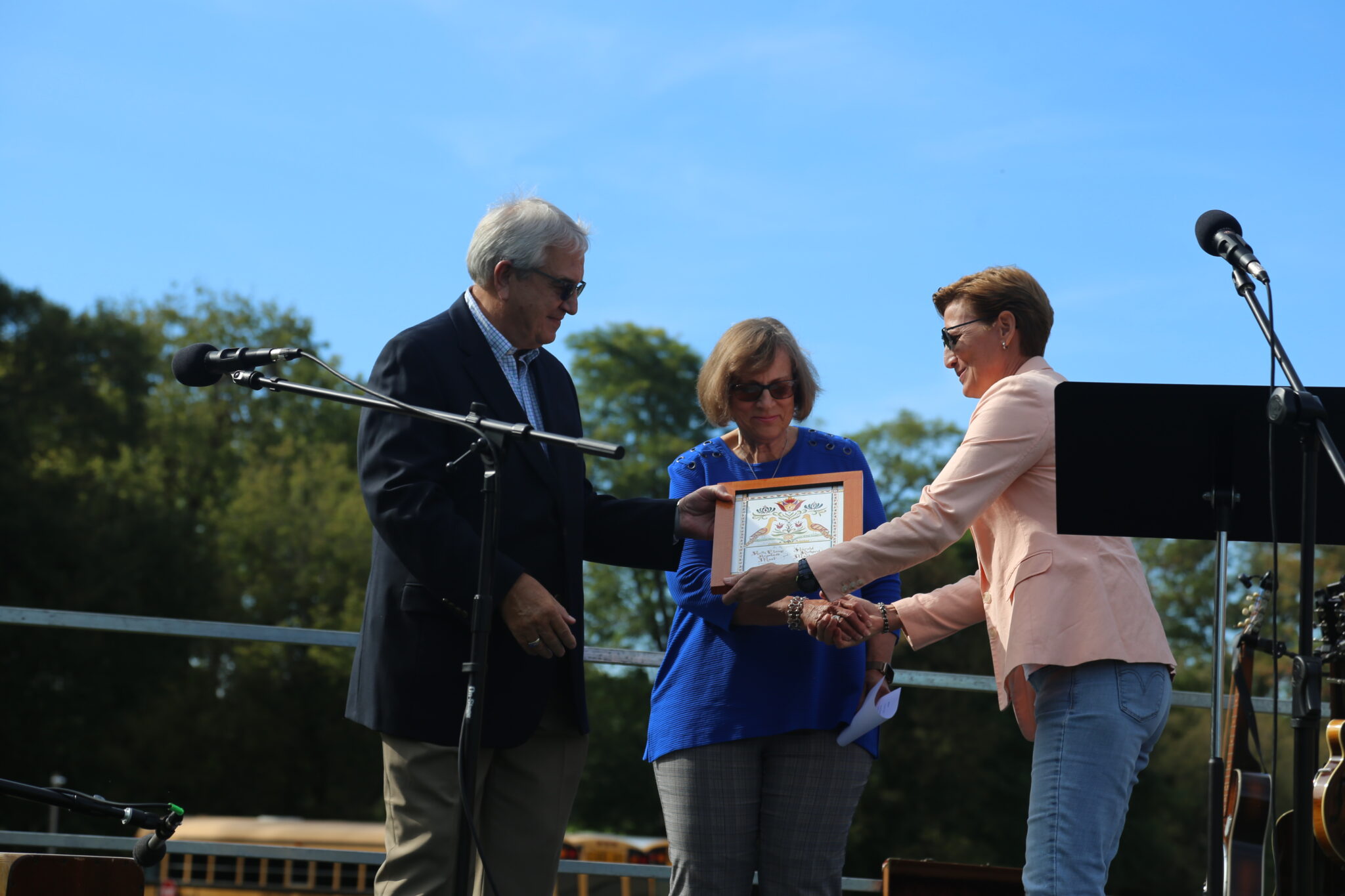 Pam presenting Harold and Ruth with award