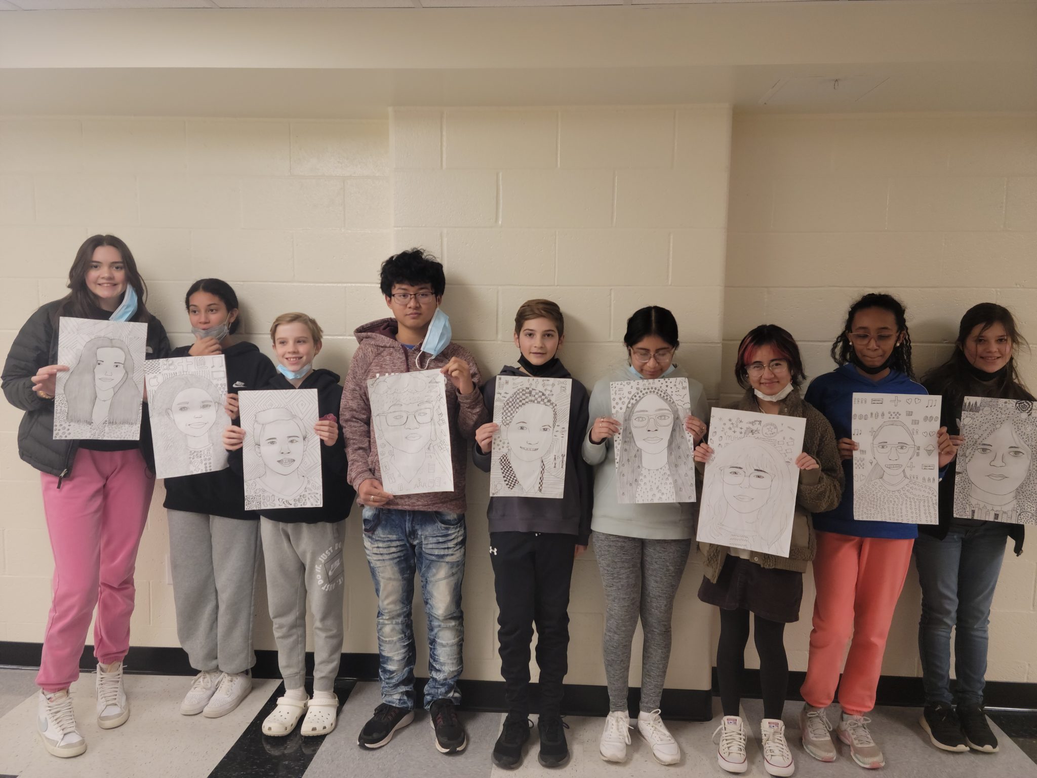 Middle School Students displaying their artwork