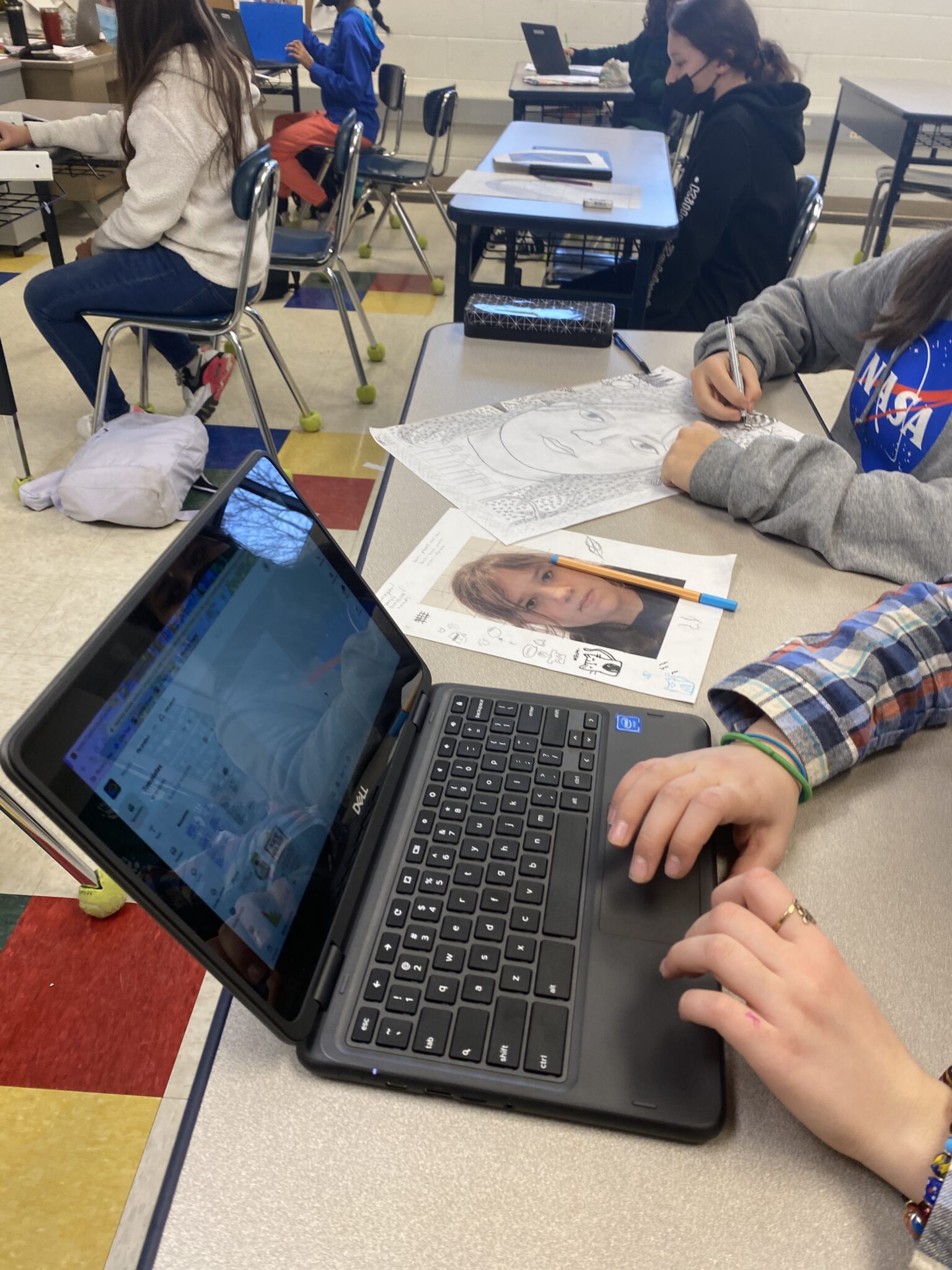 Students on laptop working on project