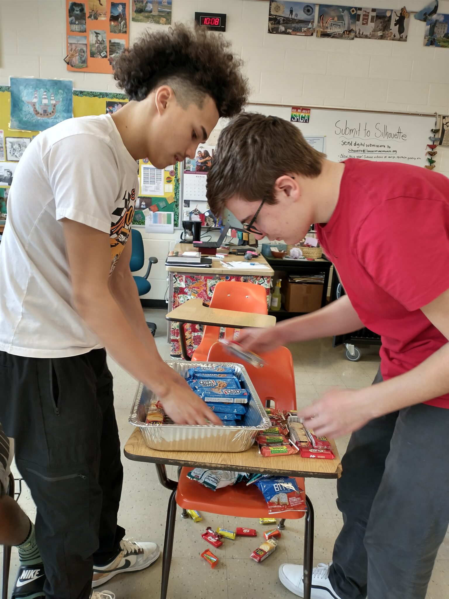 two boys packaging donations