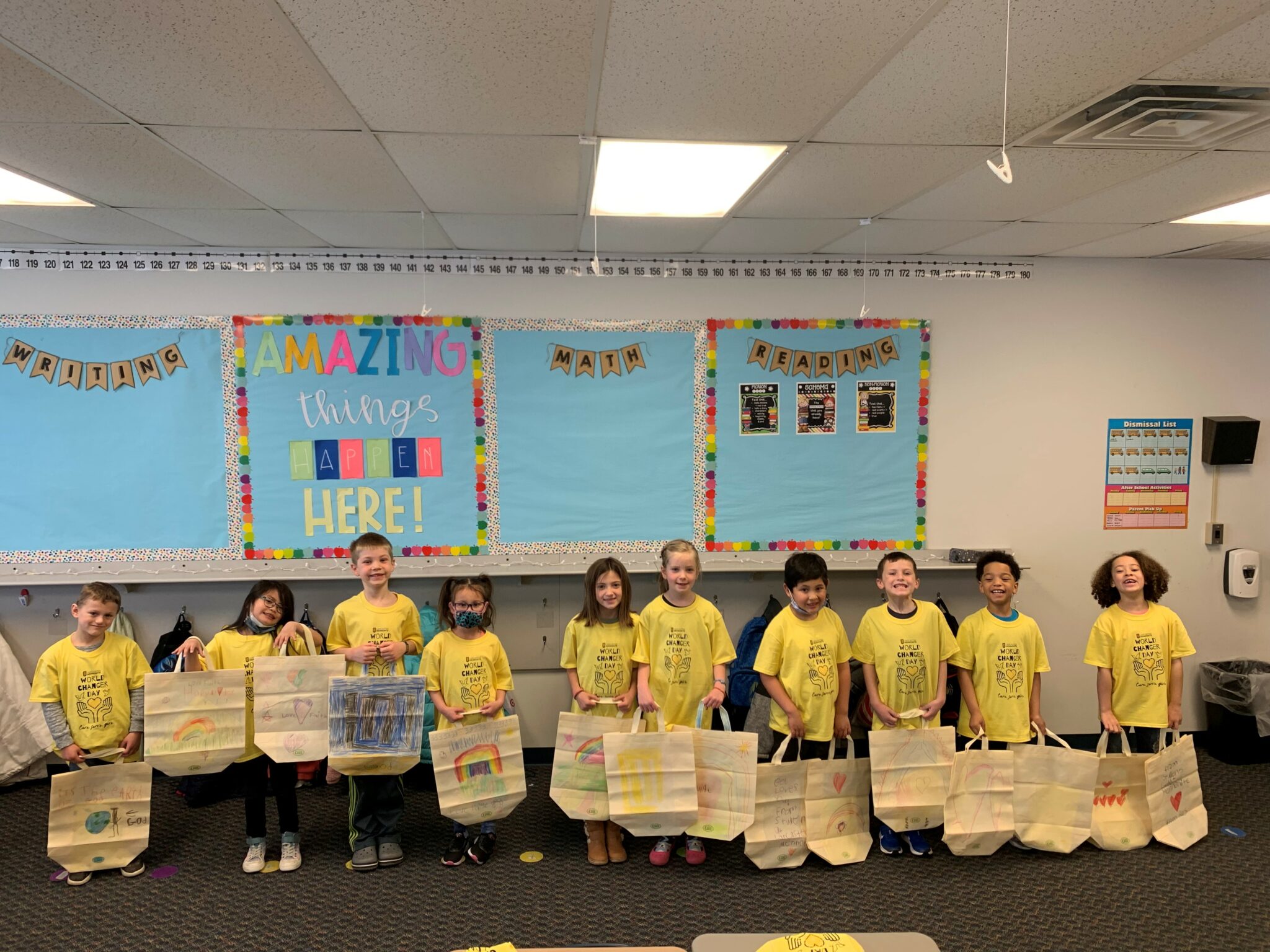 elementary students holding bags