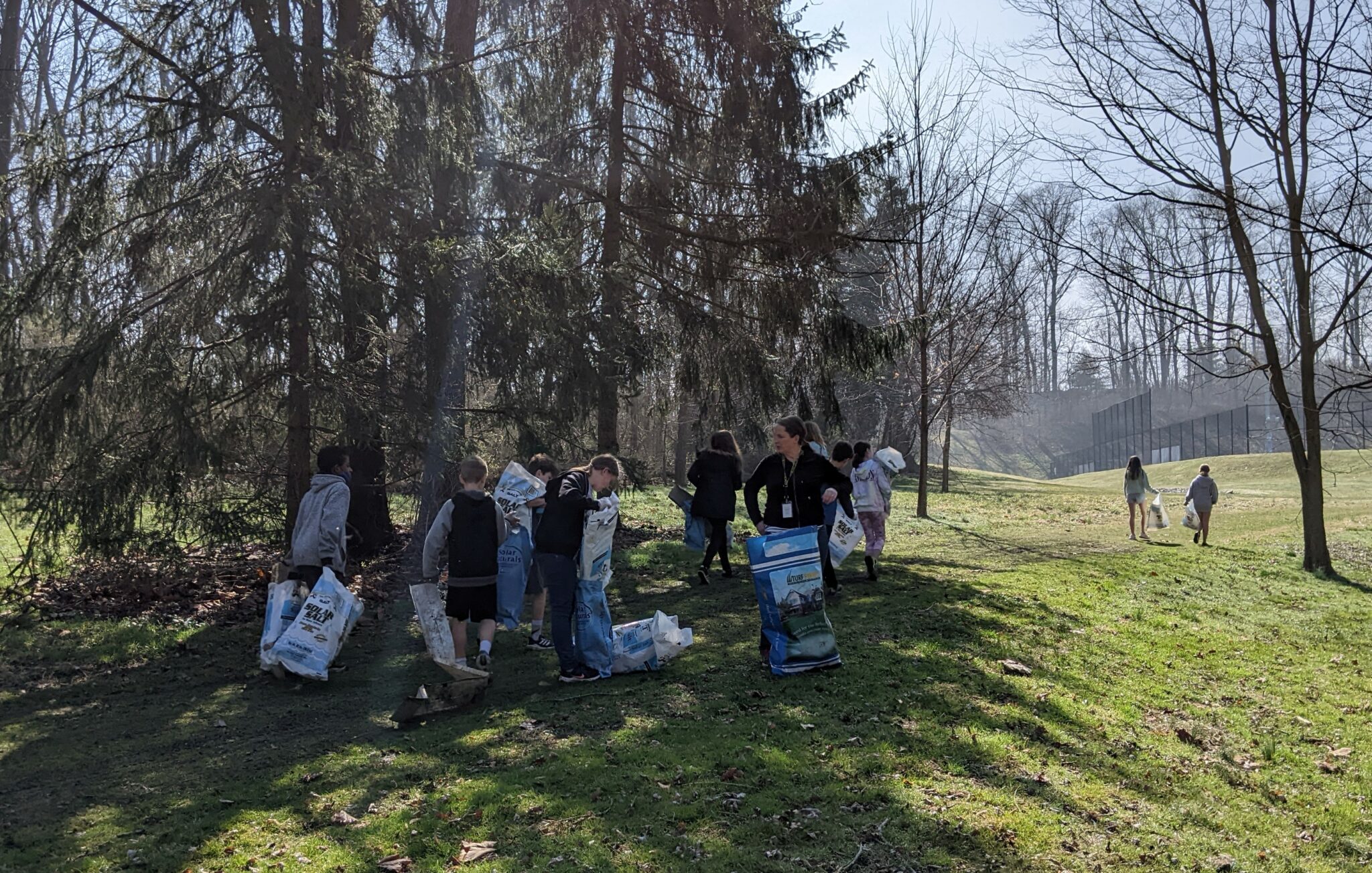 Students cleaning up outside.