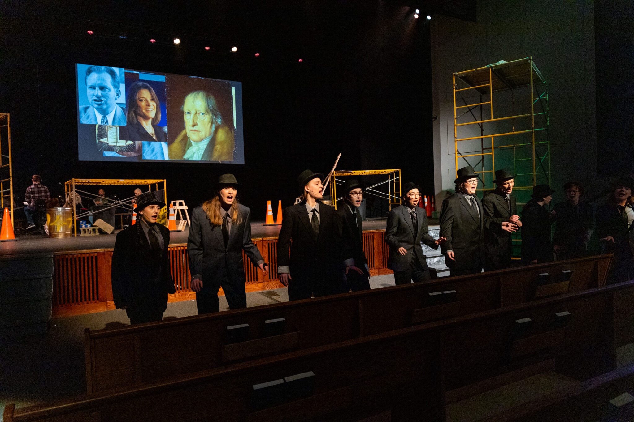 students in suits singing