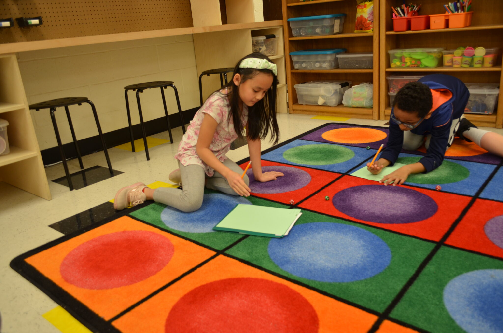 two students playing dice games