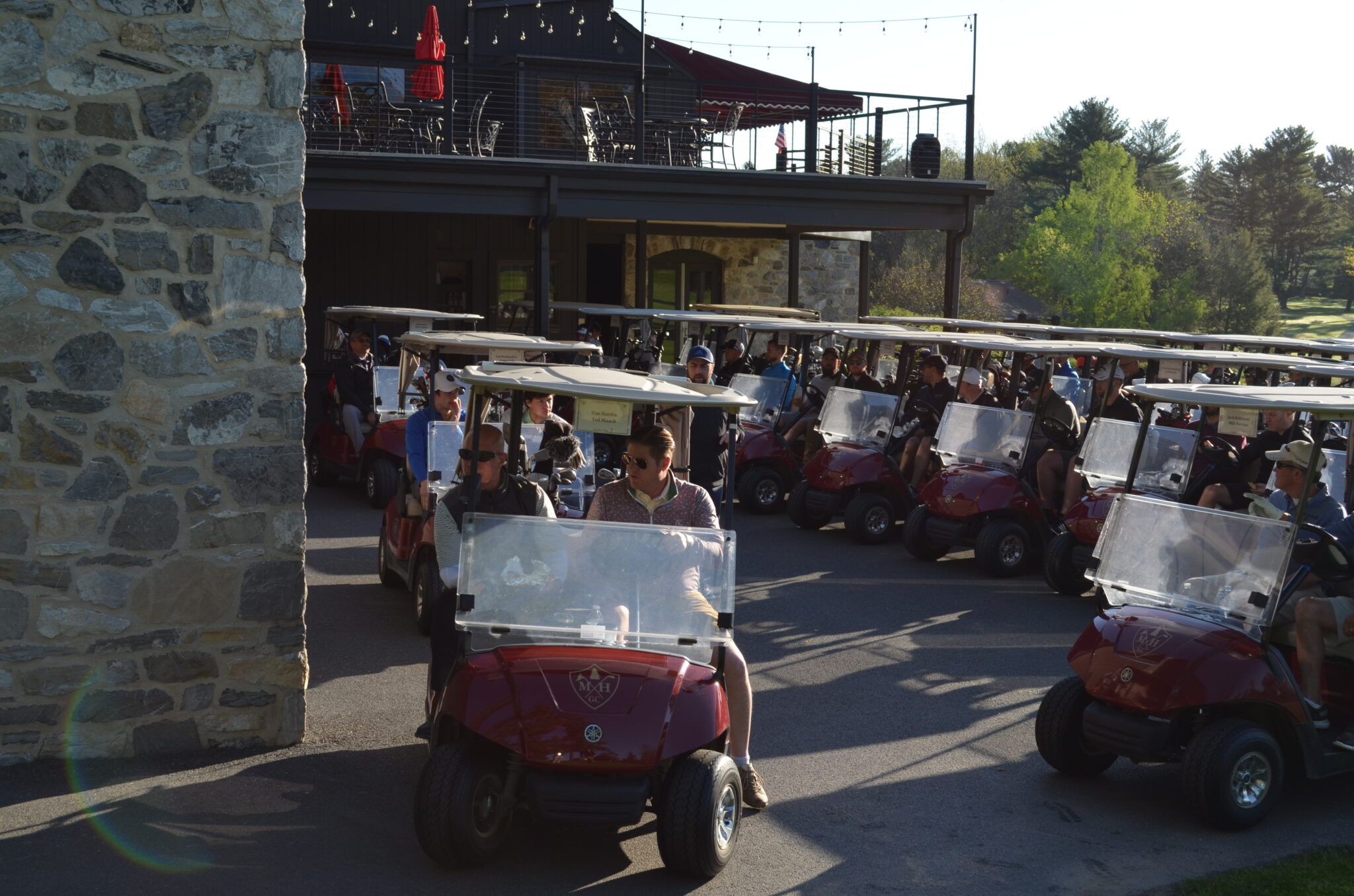 group of people in golf carts