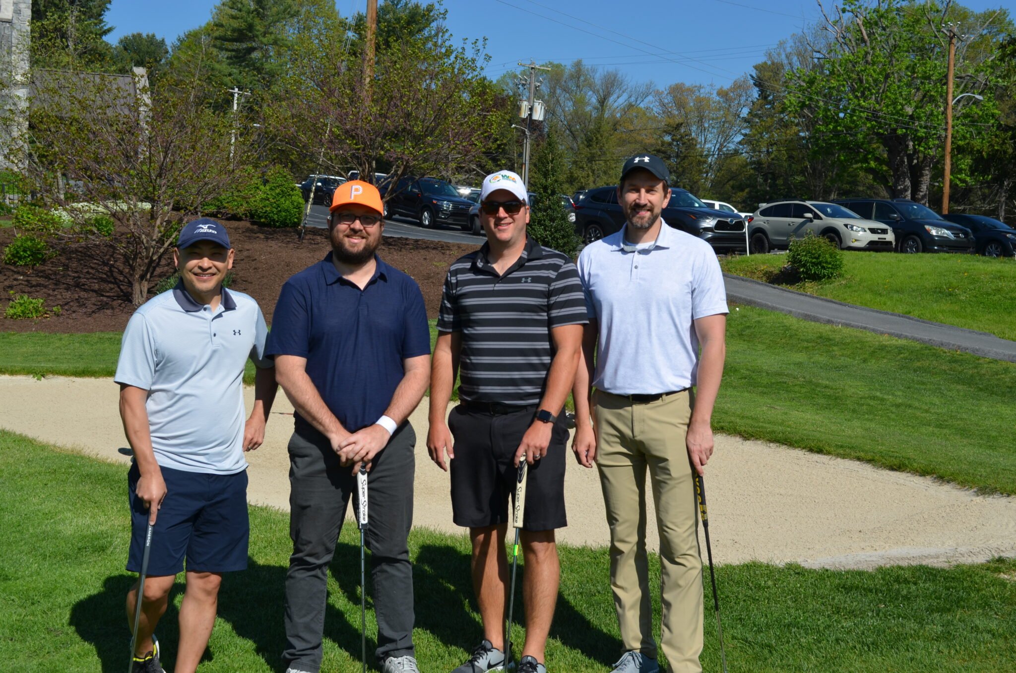 four male golfers