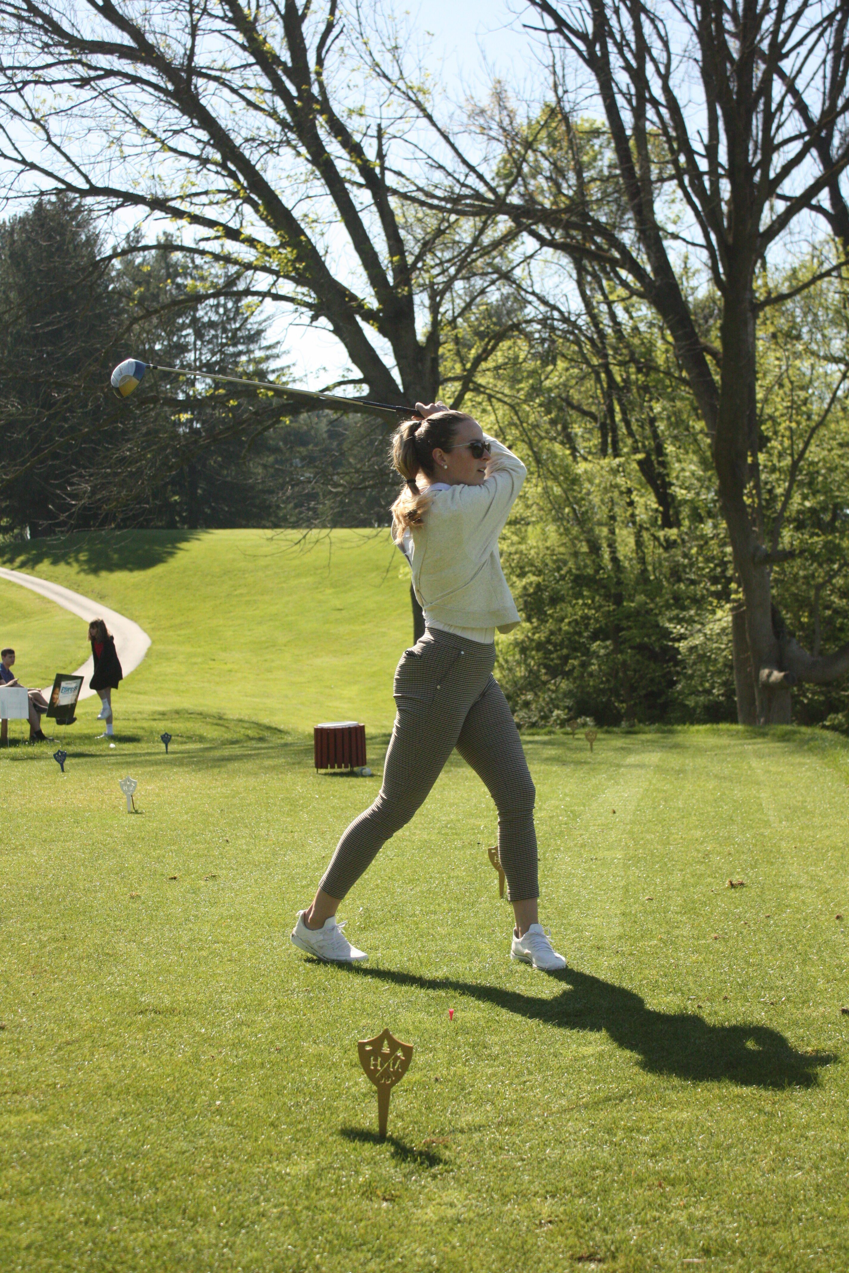 woman driving golf ball