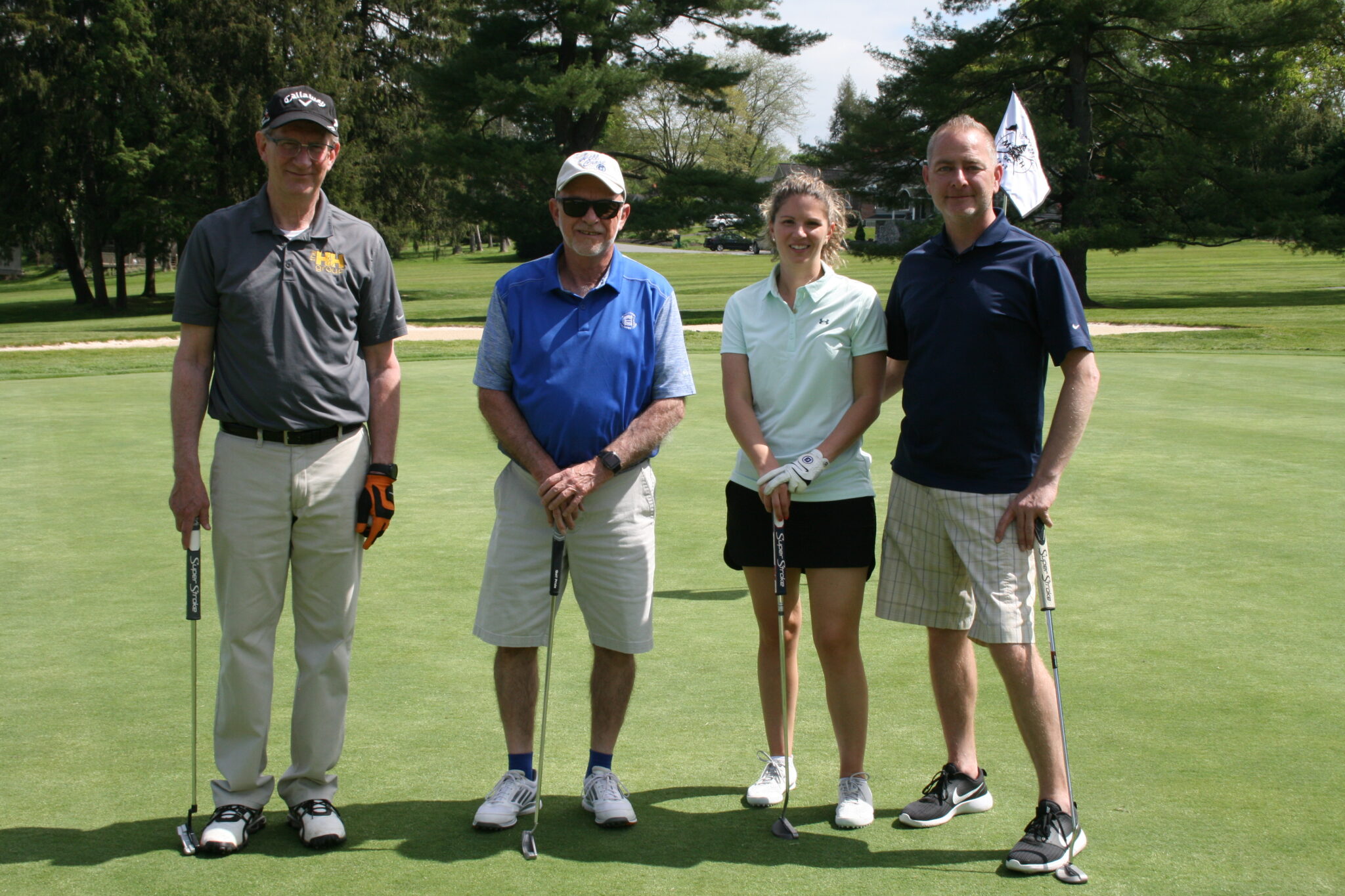 golfing team on the green