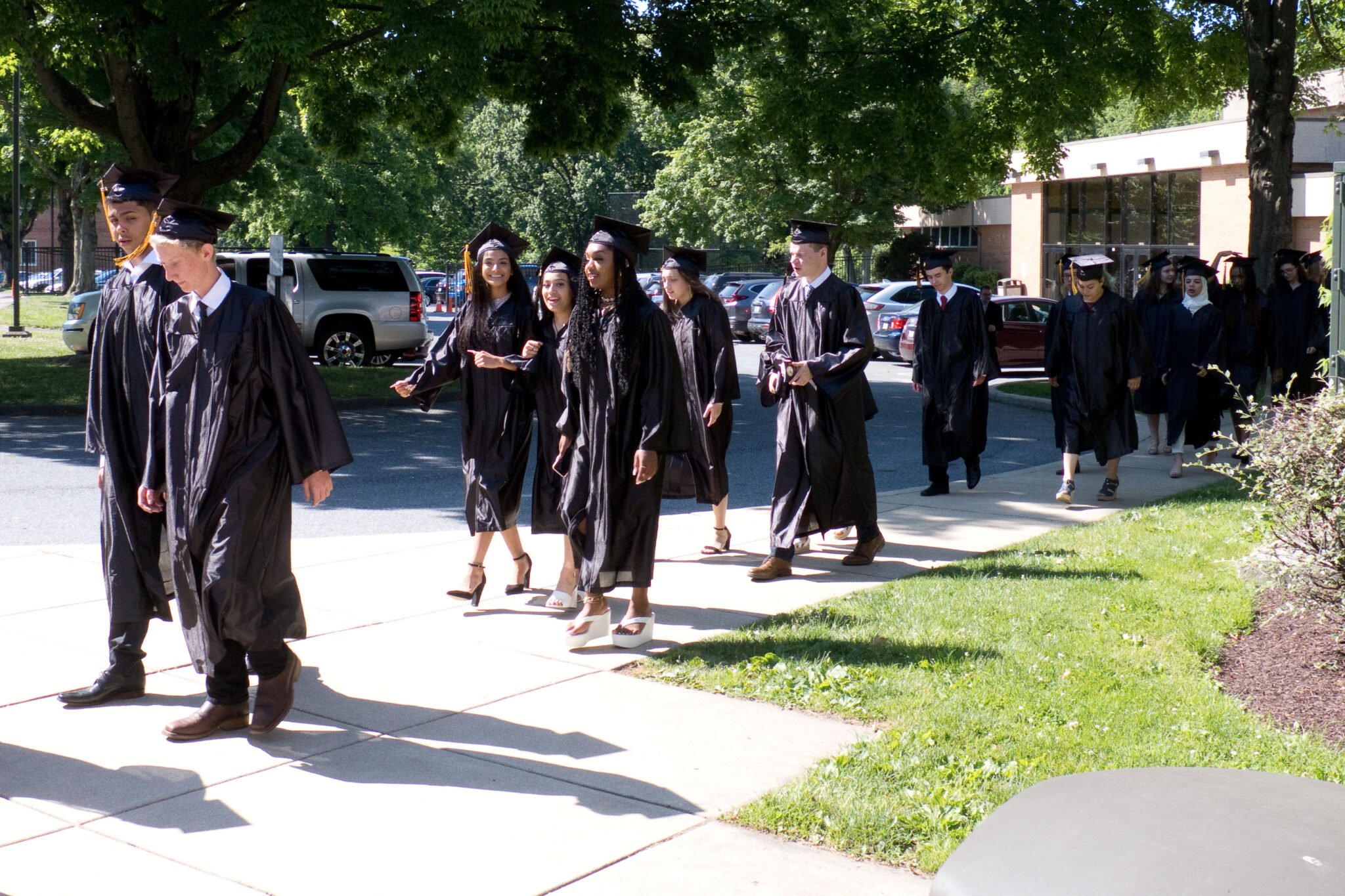 grads walking from ceremony