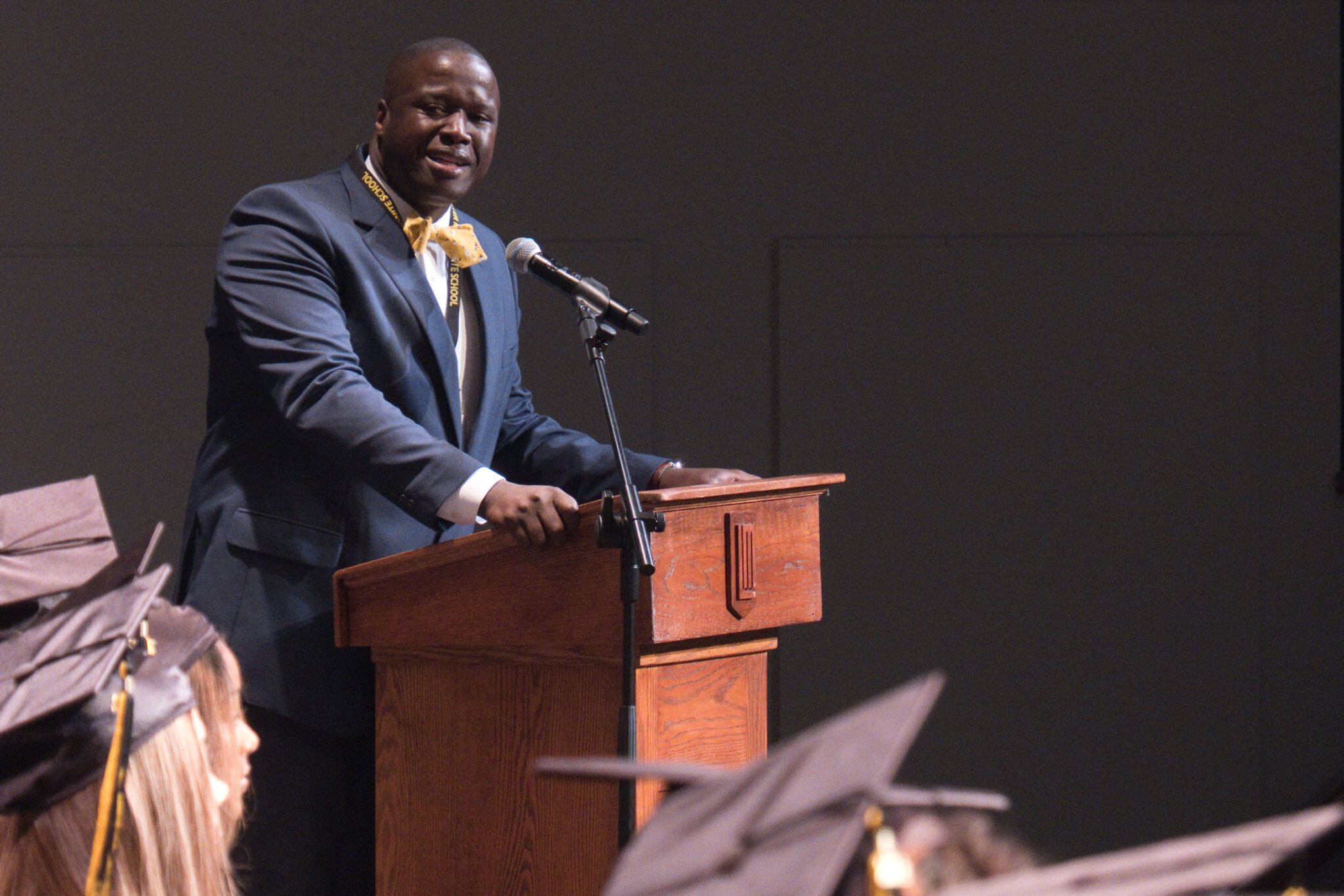 principal speaking at podium