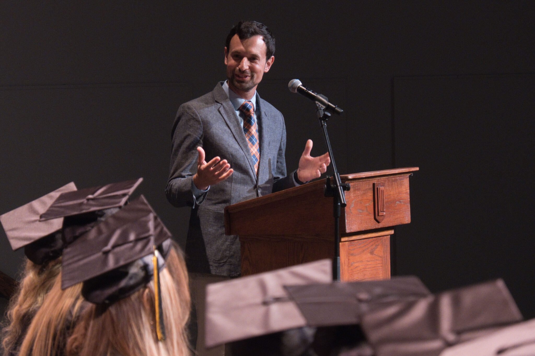 man speaking at podium