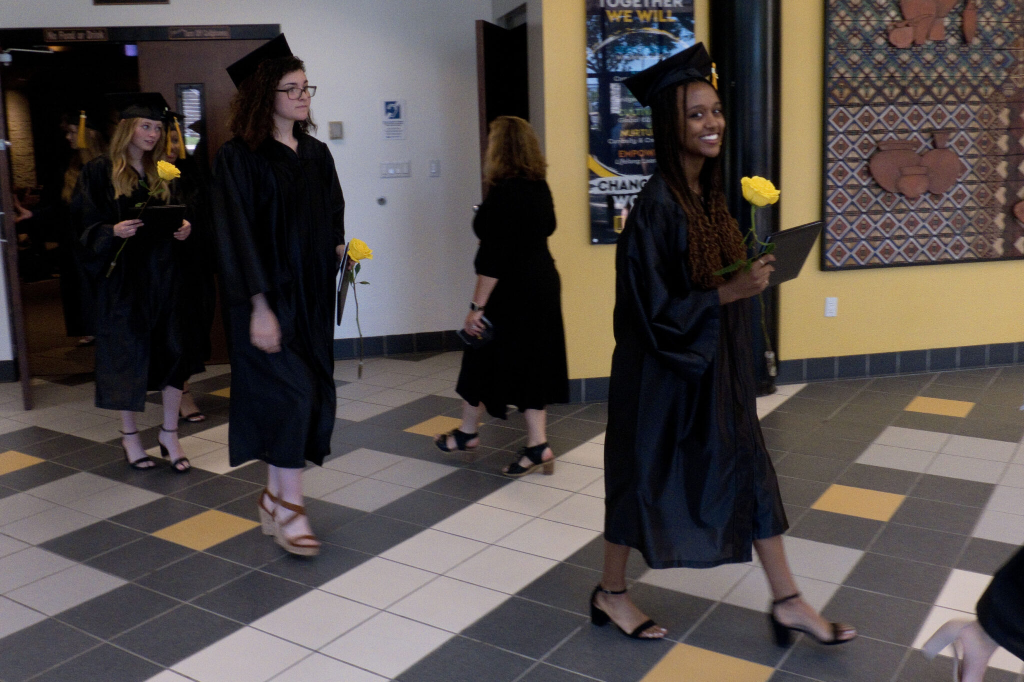 grads walking to ceremony