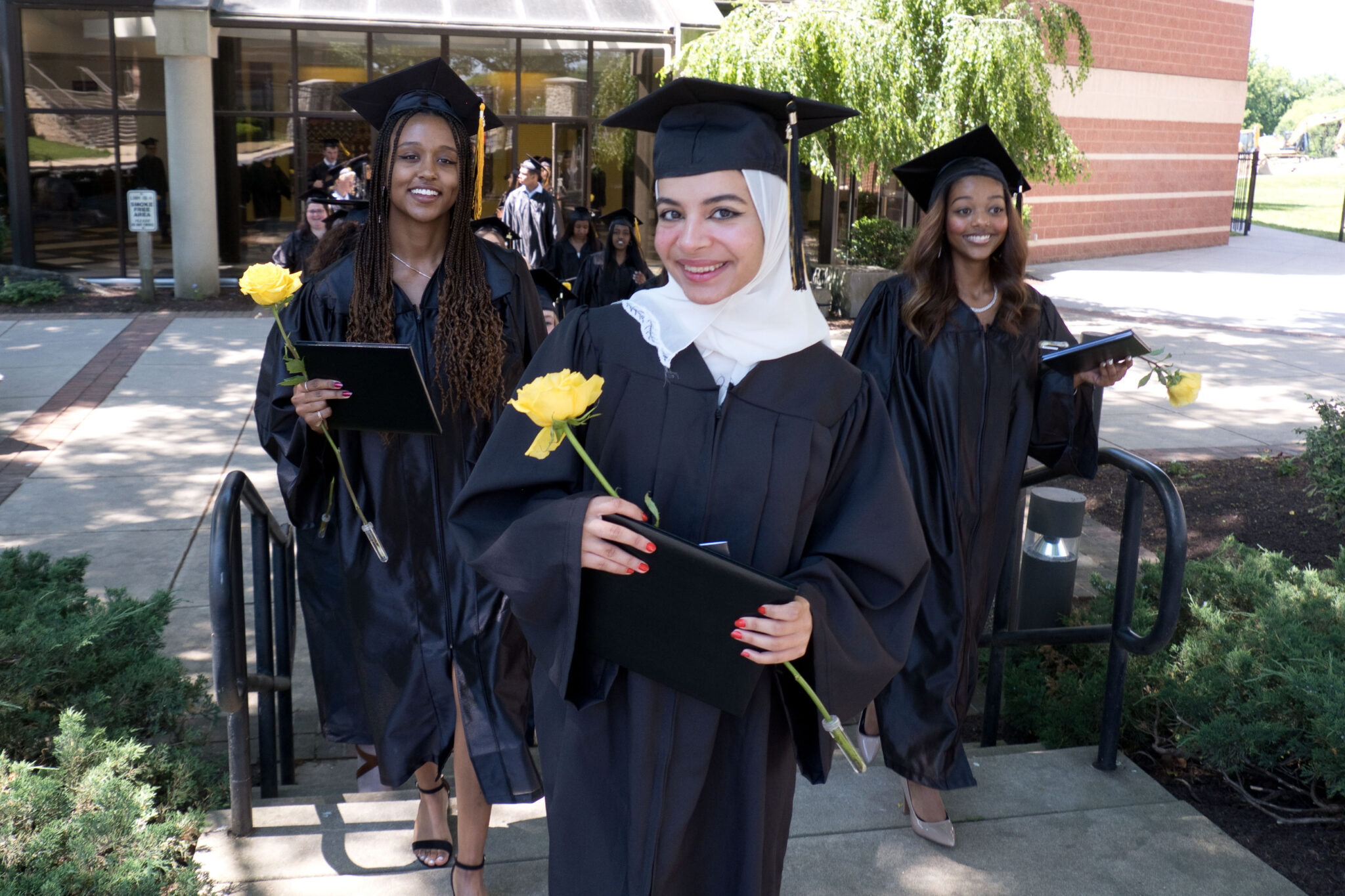 grads walking to ceremony