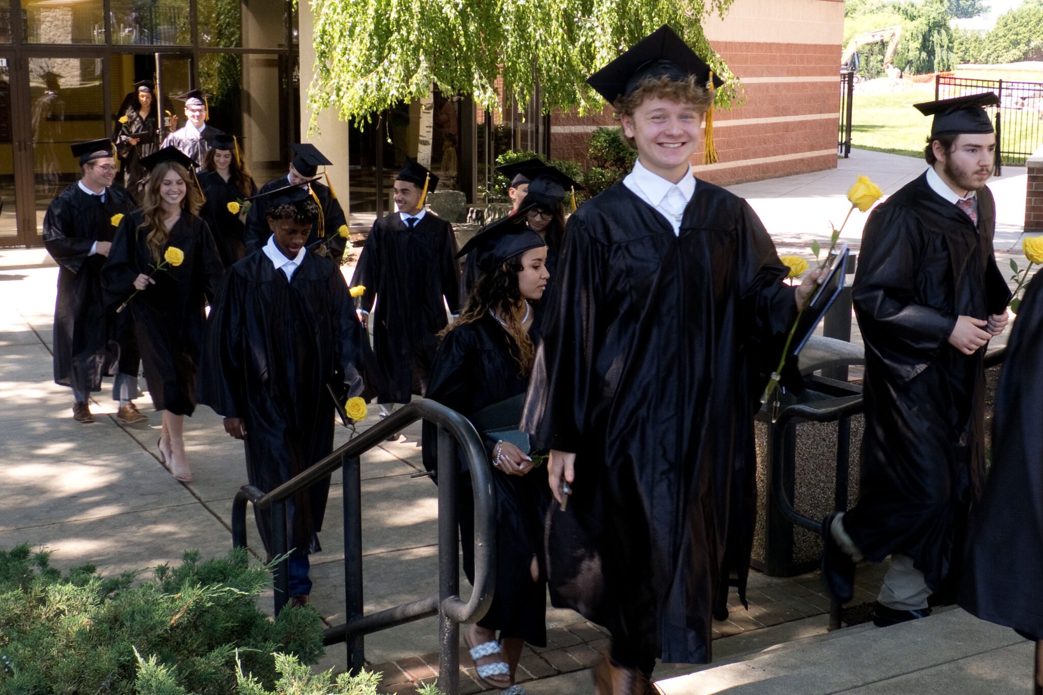 grads walking to ceremony