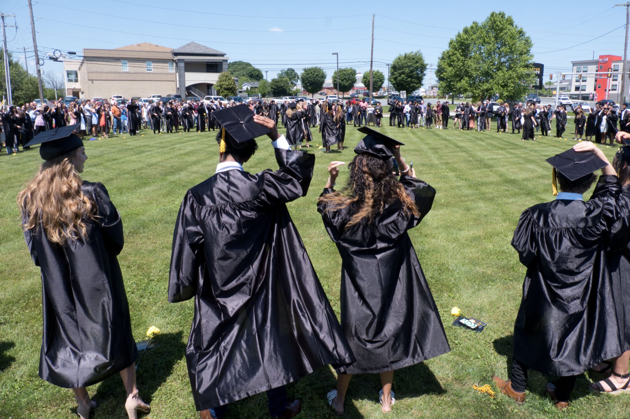 grads throwing caps