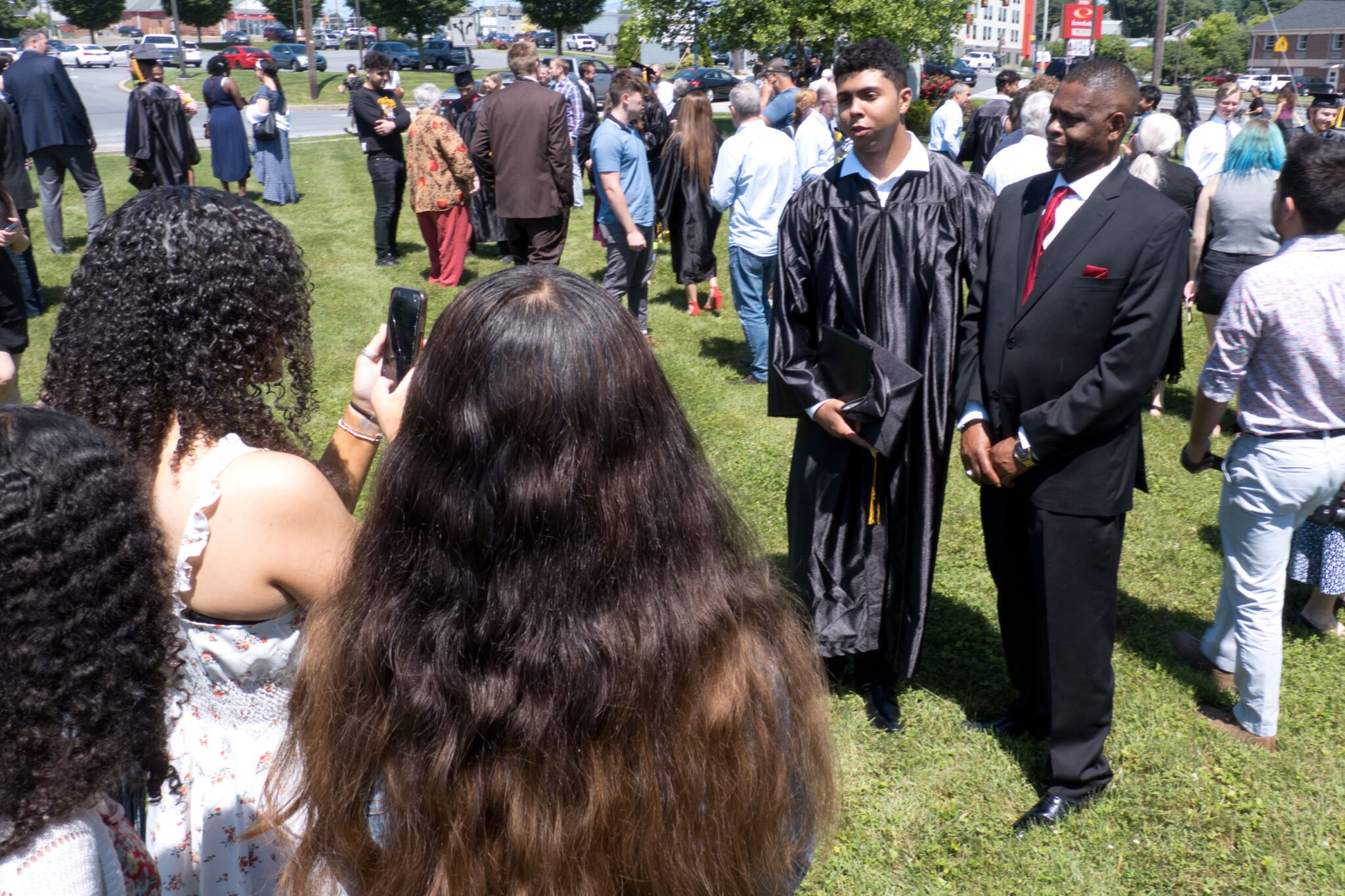 families taking photos at graduation