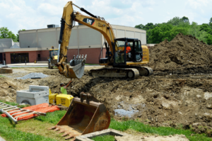 Up close of the construction equipment working to create the space for the new playground.