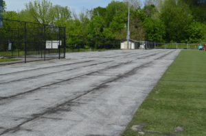 The turf field is being rolled out in pieces so a new and updated surface can be placed.