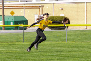 softball player catching the ball