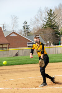 softball player throwing the ball