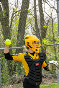 girl pitching softball