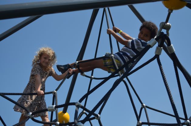 two students playing on the playground