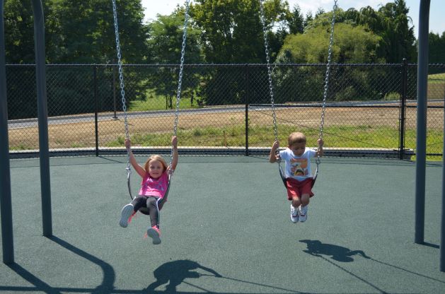 two students swinging