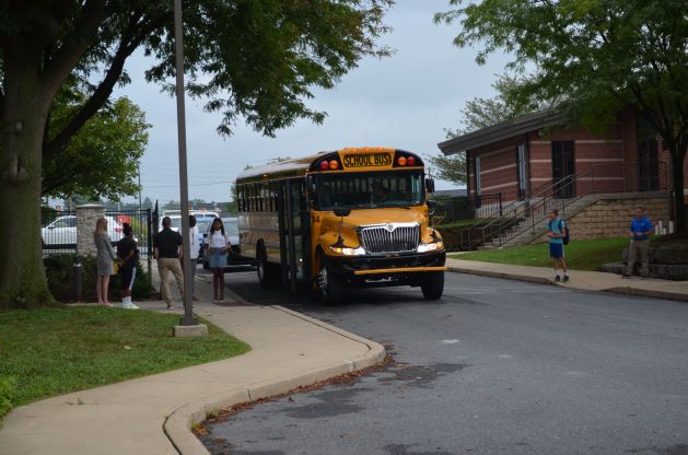 students getting off the bus.