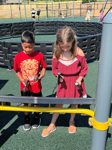 Two students playing outside