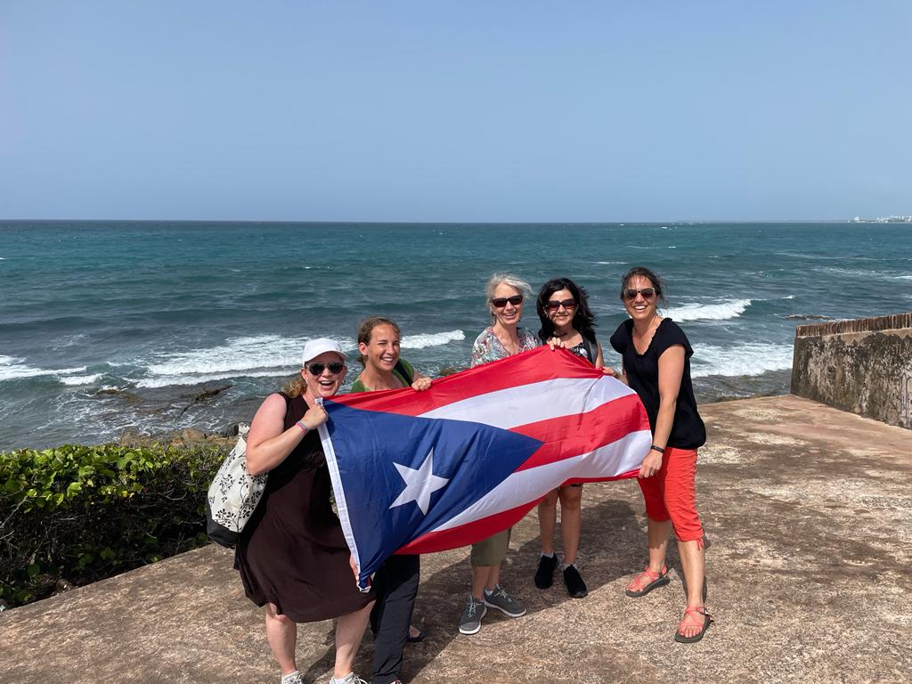 lm spanish teachers holding pr flag