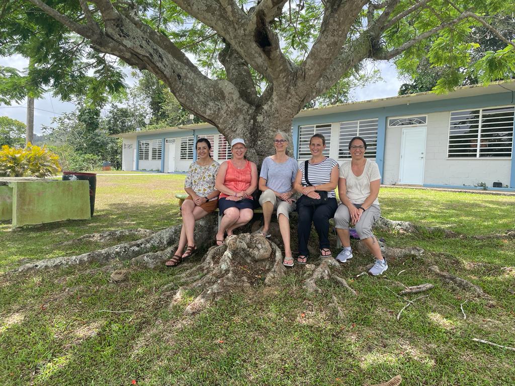 lm spanish teachers sitting under tree